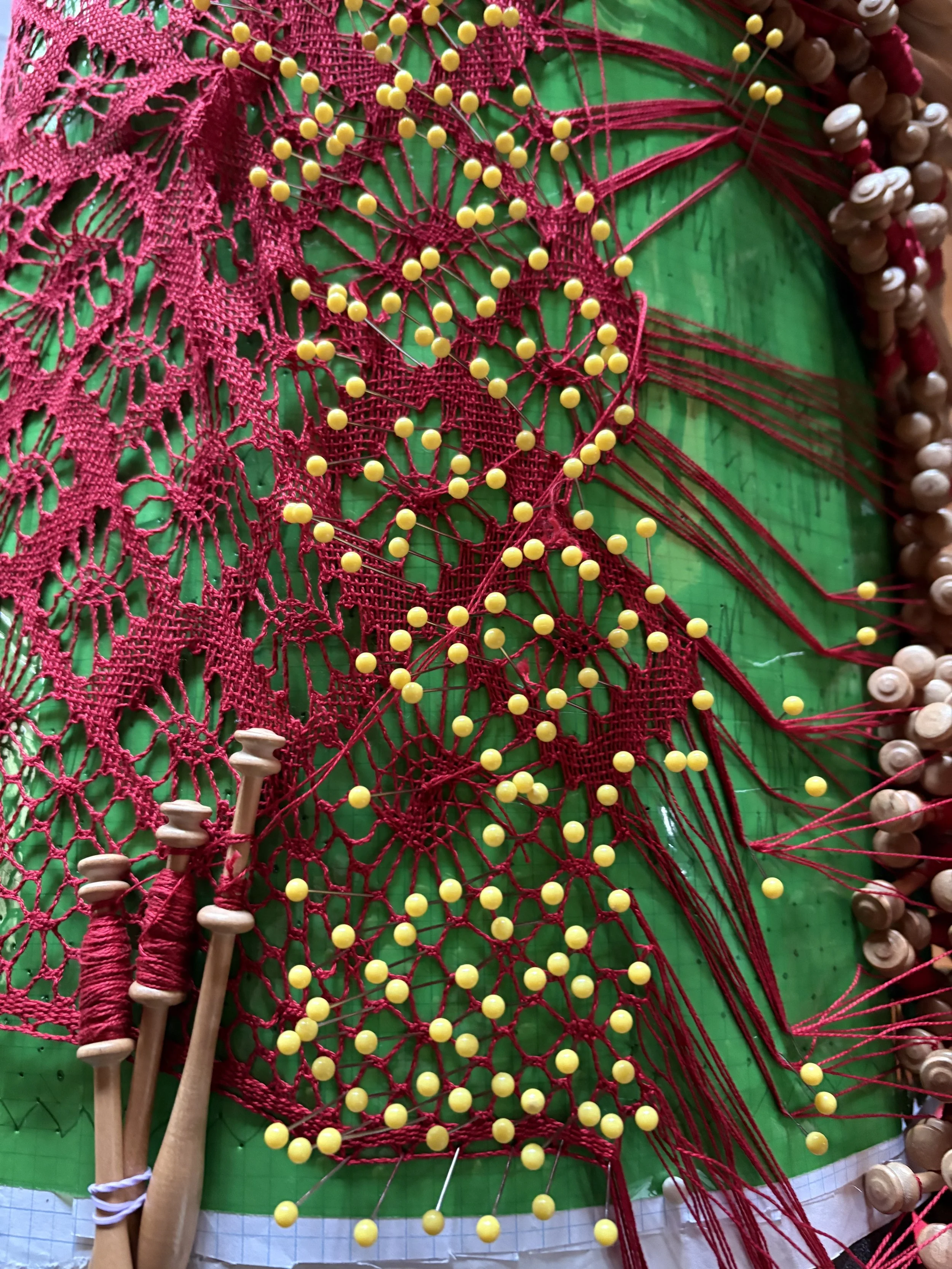 Part of the process, the pins position the threads