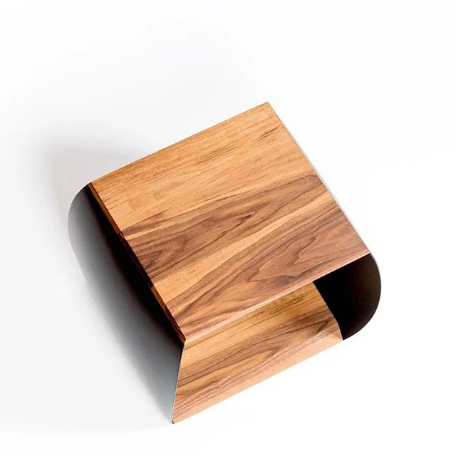 Side table in carbon/walnut. Super thin carbon sides are strong enough for the table to function as a bench 📷@kylervos