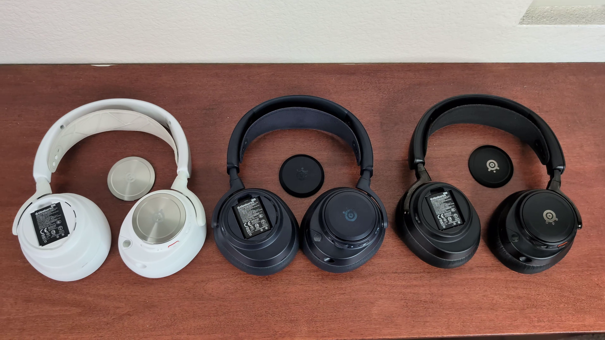 image of 3 headsets with battery cover open