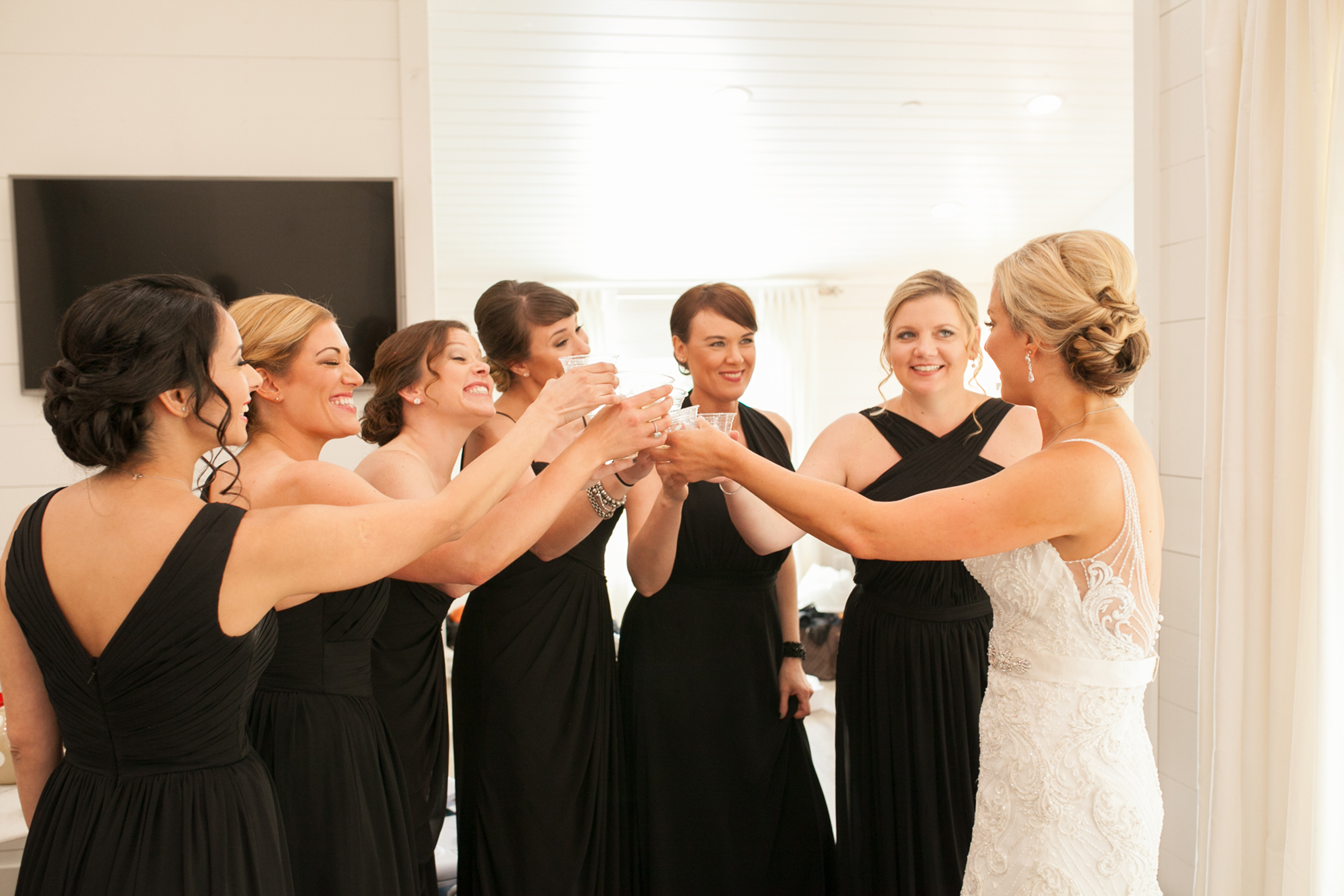 Bride and Bridesmaids toasting to the wedding day!