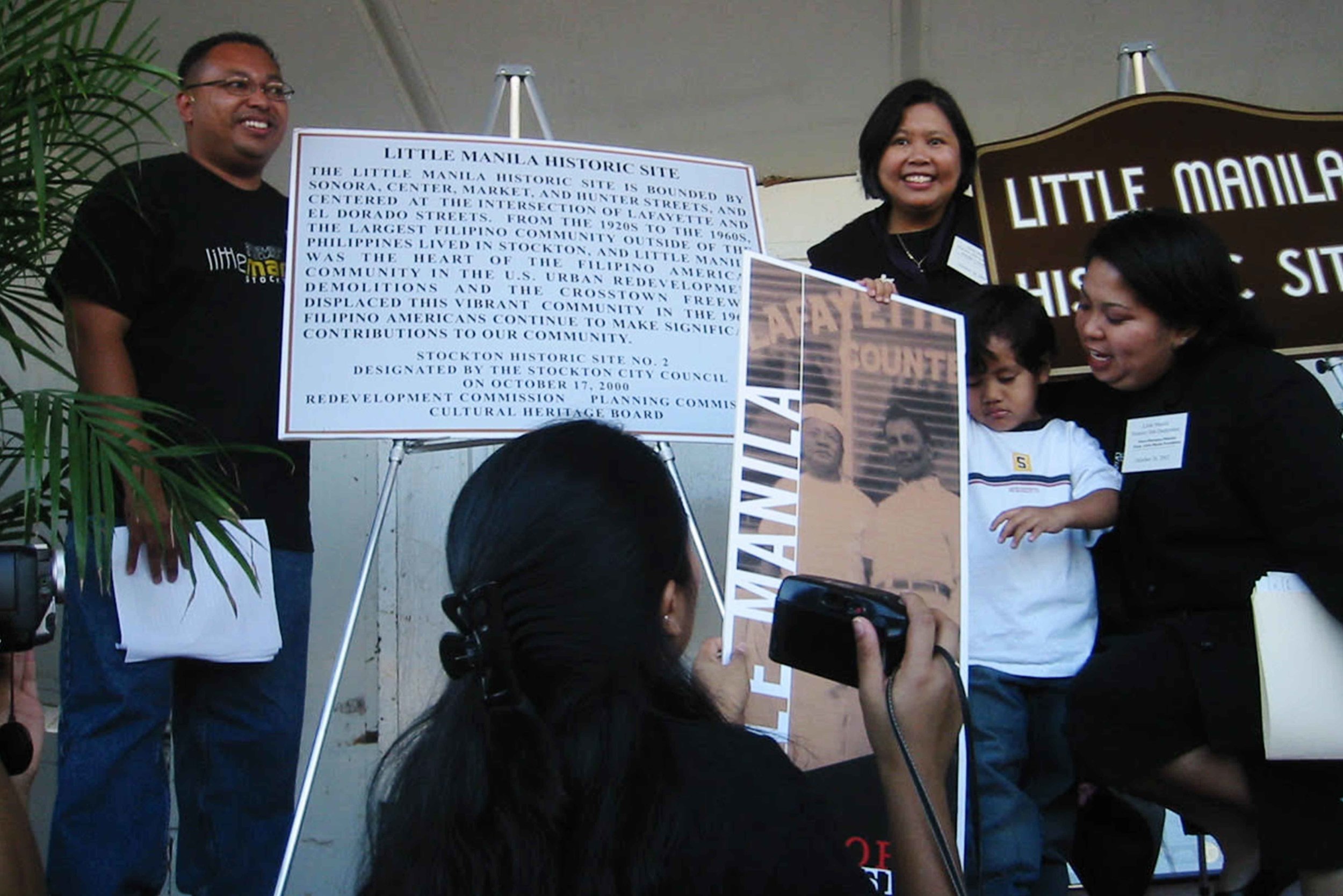  Little Manila Rising co-founders Dillon Delvo (far left) and Dawn Bohulano Mabalon (far right) at the dedication event for the Little Manila Historic Site in Stockton, California. Courtesy of Dillon Delvo.    