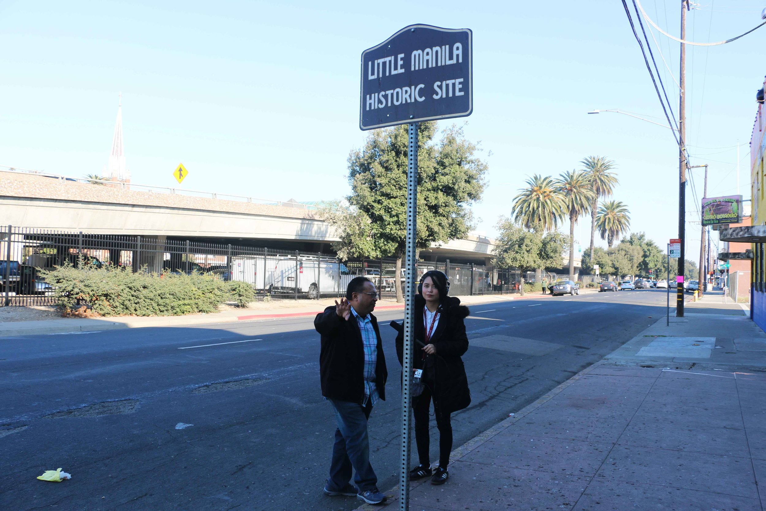  Little Manila Rising co-founder and executive director Dillon Delvo and Long Distance host and producer Paola Mardo at the Little Manila Historic Site in Stockton, California. Photo by Patrick Epino. 