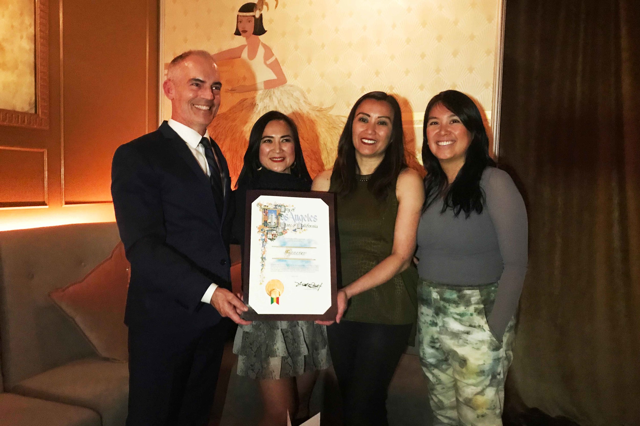  Councilmember Mitch O’Farrell presents the City Certificate of Recognition to Genever owners Christine “Tinette” Sumiller, Patricia “Tricia” Perez, and Roselma Samala. Photo by Paola Mardo. 