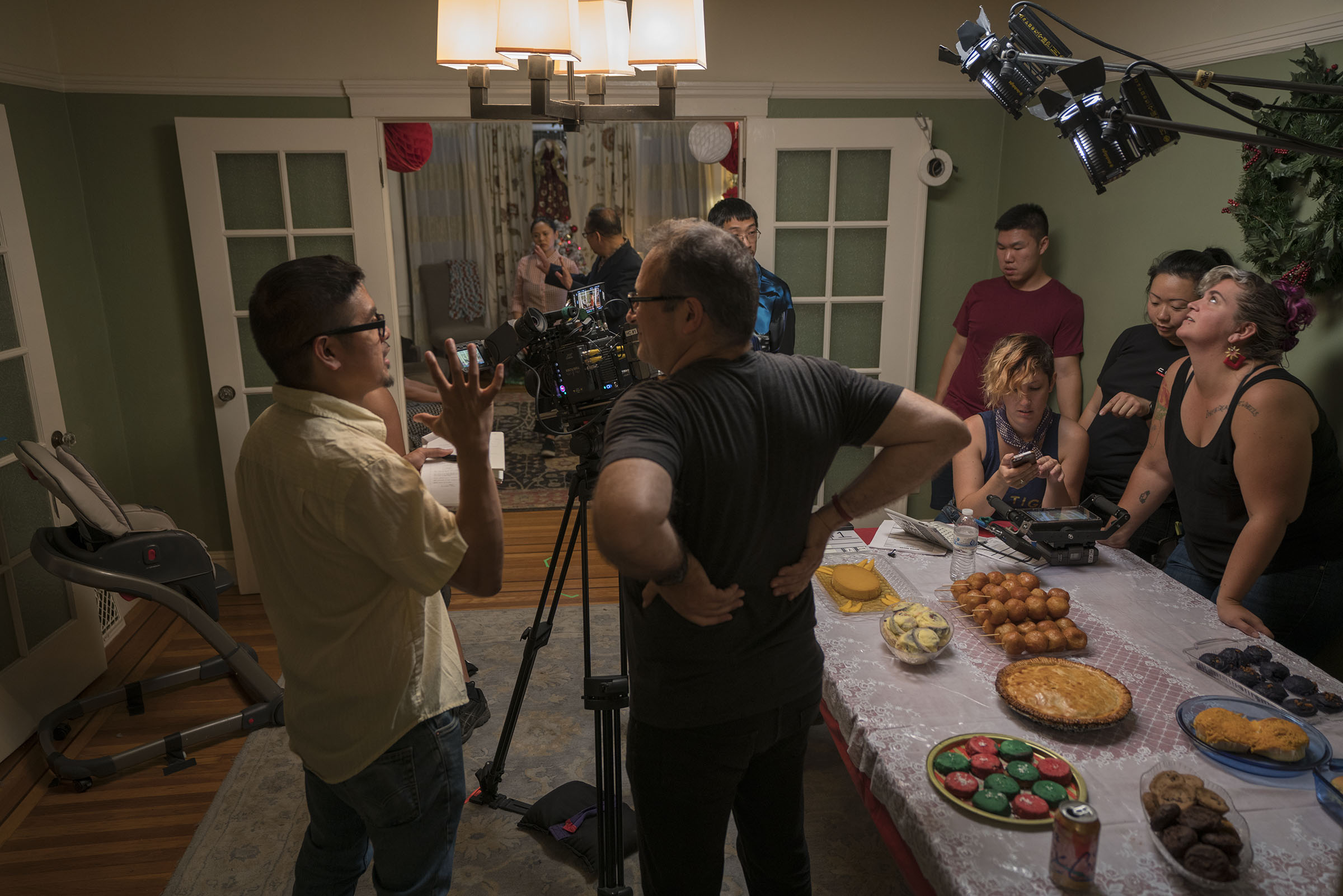 Director H.P. Mendoza (left) with cast and crew on the set of Bitter Melon. Photo by Susie Heyden. Courtesy Ersatz Film.