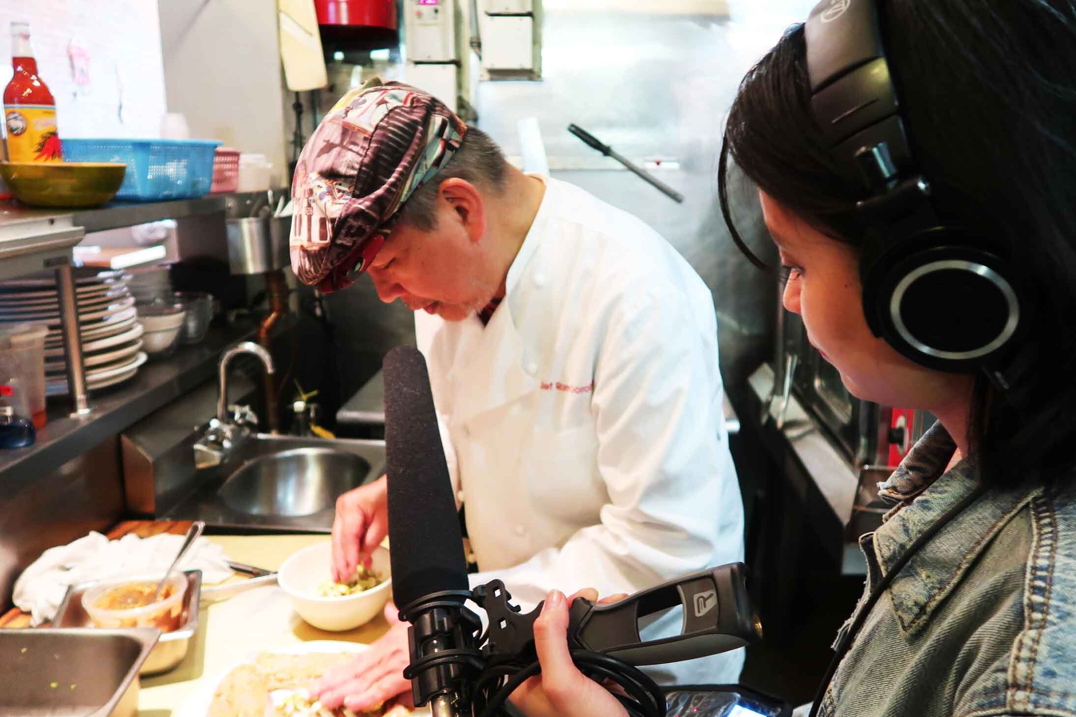  Chef Romy Dorotan prepares fish sinigang with Long Distance host/producer Paola Mardo at Purple Yam Brooklyn. Photo by Patrick Epino. 