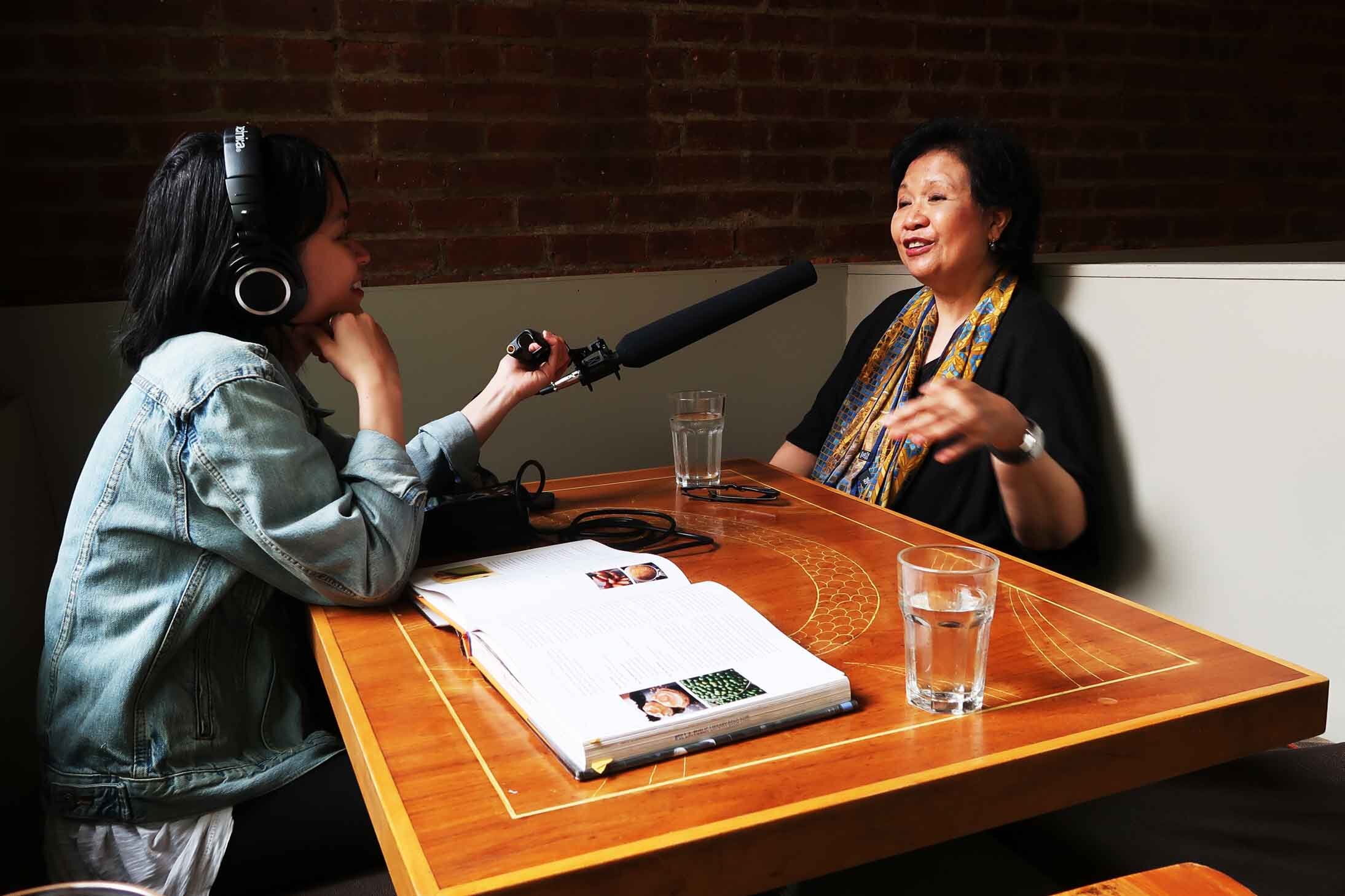  Long Distance host/producer Paola Mardo speaks with Amy Besa, author of “Memories of Philippine Kitchens” and owner of Purple Yam Brooklyn and Purple Yam Malate. Photo by Patrick Epino. 