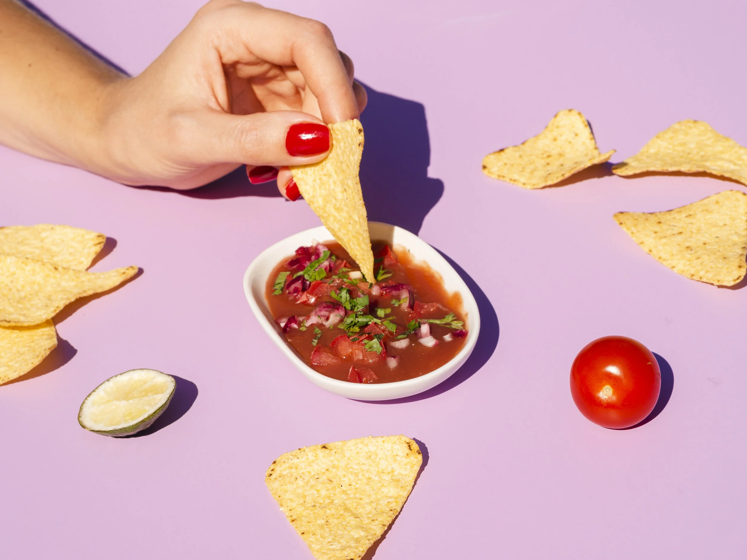 close-up-woman-with-tortilla-chips-sauce.jpg