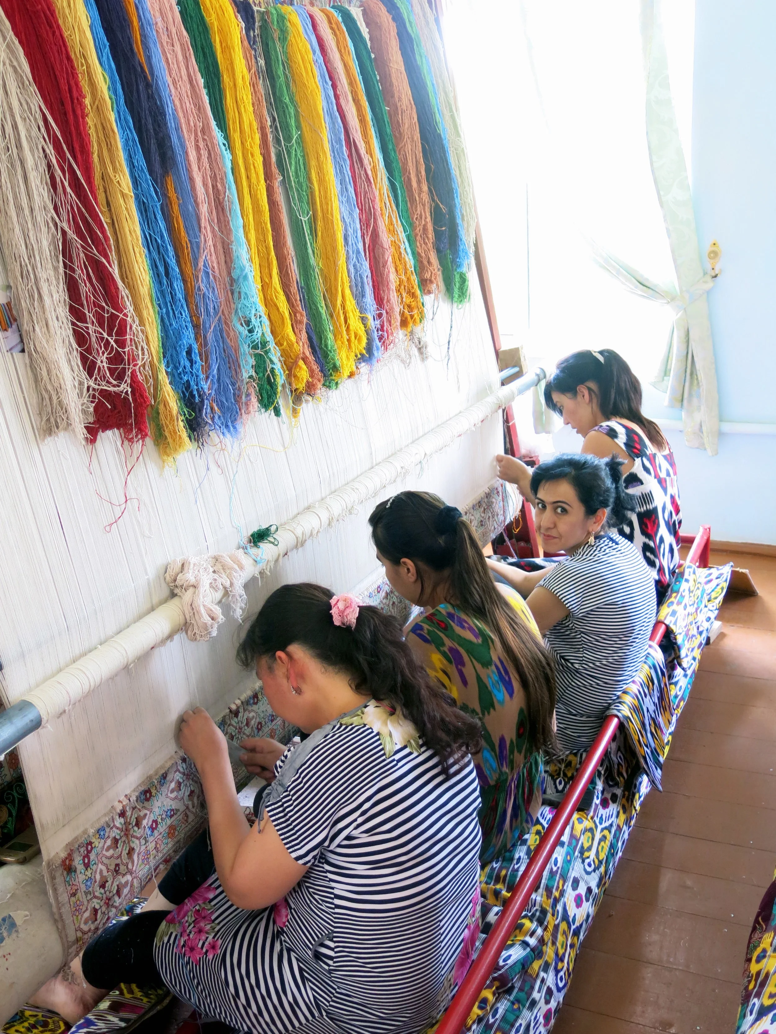 Weaving silk carpet is a an art of patience for these women