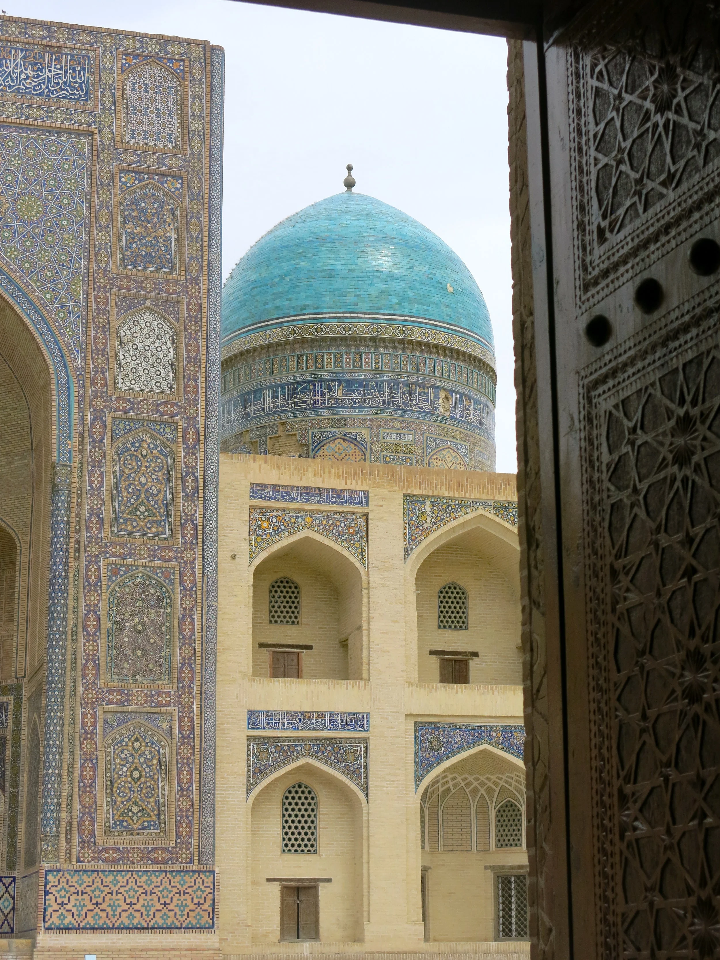 View on the madrasa from behind the doors of the mosque
