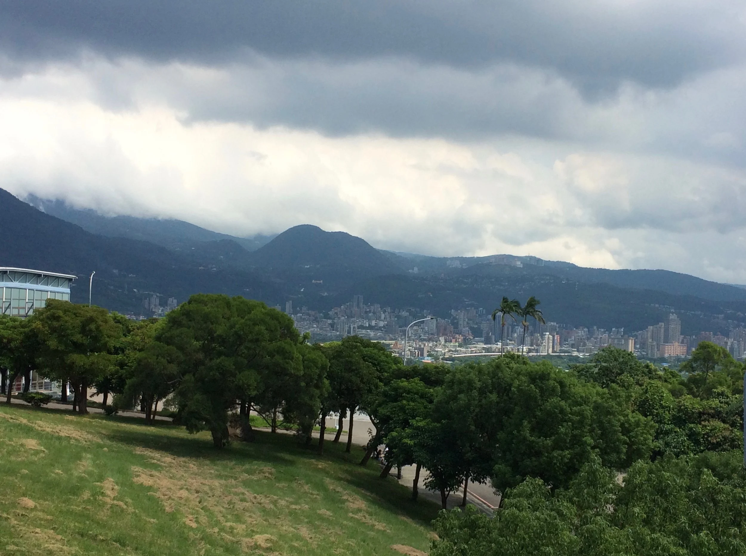 Looking out from the Guest House toward misty mountains and parts of extended New Taipei City