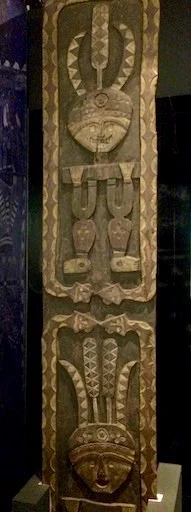Paiwan wood carving showing related patterns of hundred-pace snake and eagle feathers