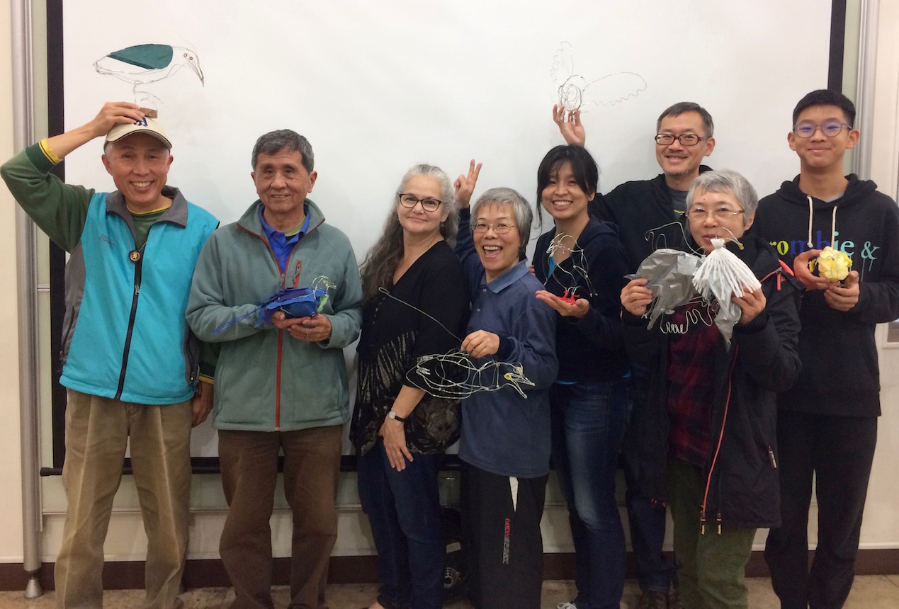 Volunteers at Guandu Nature Park display their wire-and-mixed-media bird sculptures
