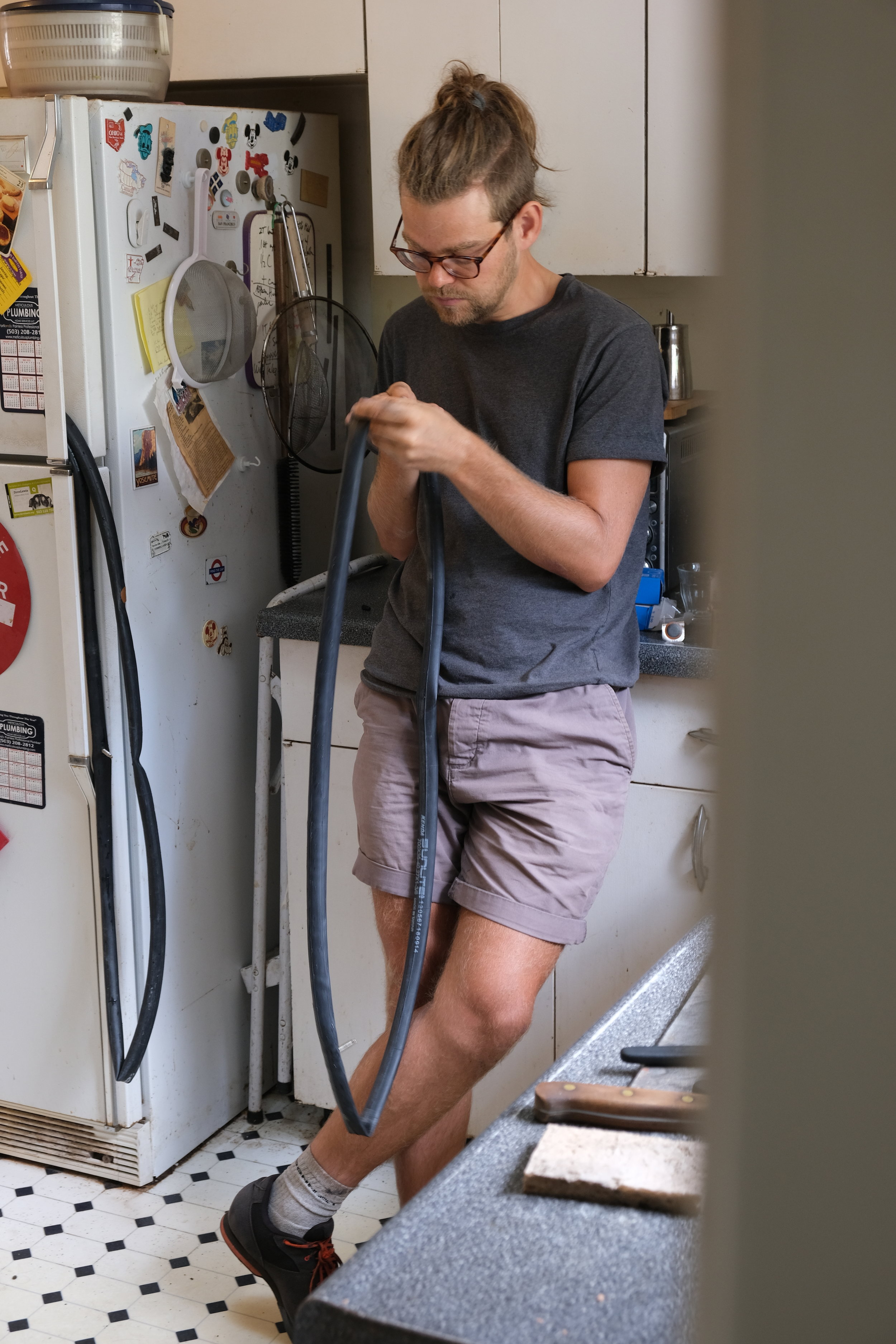 An intimate photograph of a man fixing his tubes