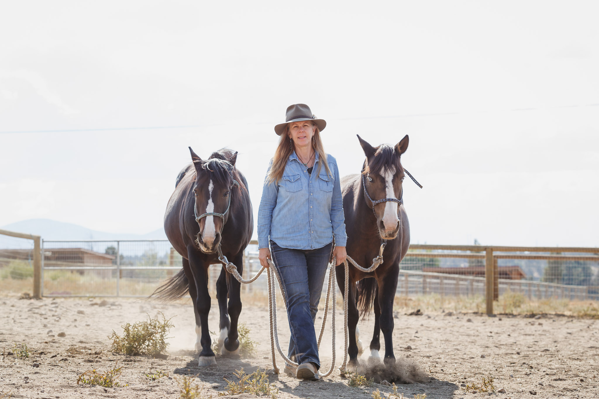 Melanie, director at HeartSpace Horse Santuary, in Redmond, Oregon, with Prema and Scout
