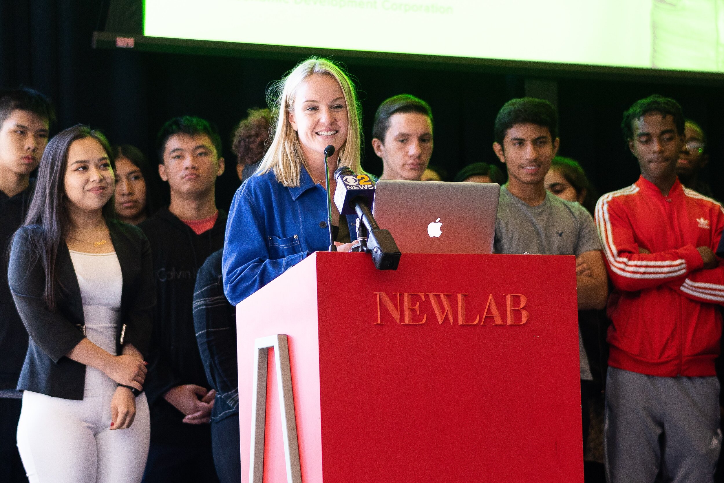   Briana Ryan, New Lab's Education Program Manager speaks at the launch event for HE3AT, the new STEAM-focused education program for Brooklyn South high school students.&nbsp;  