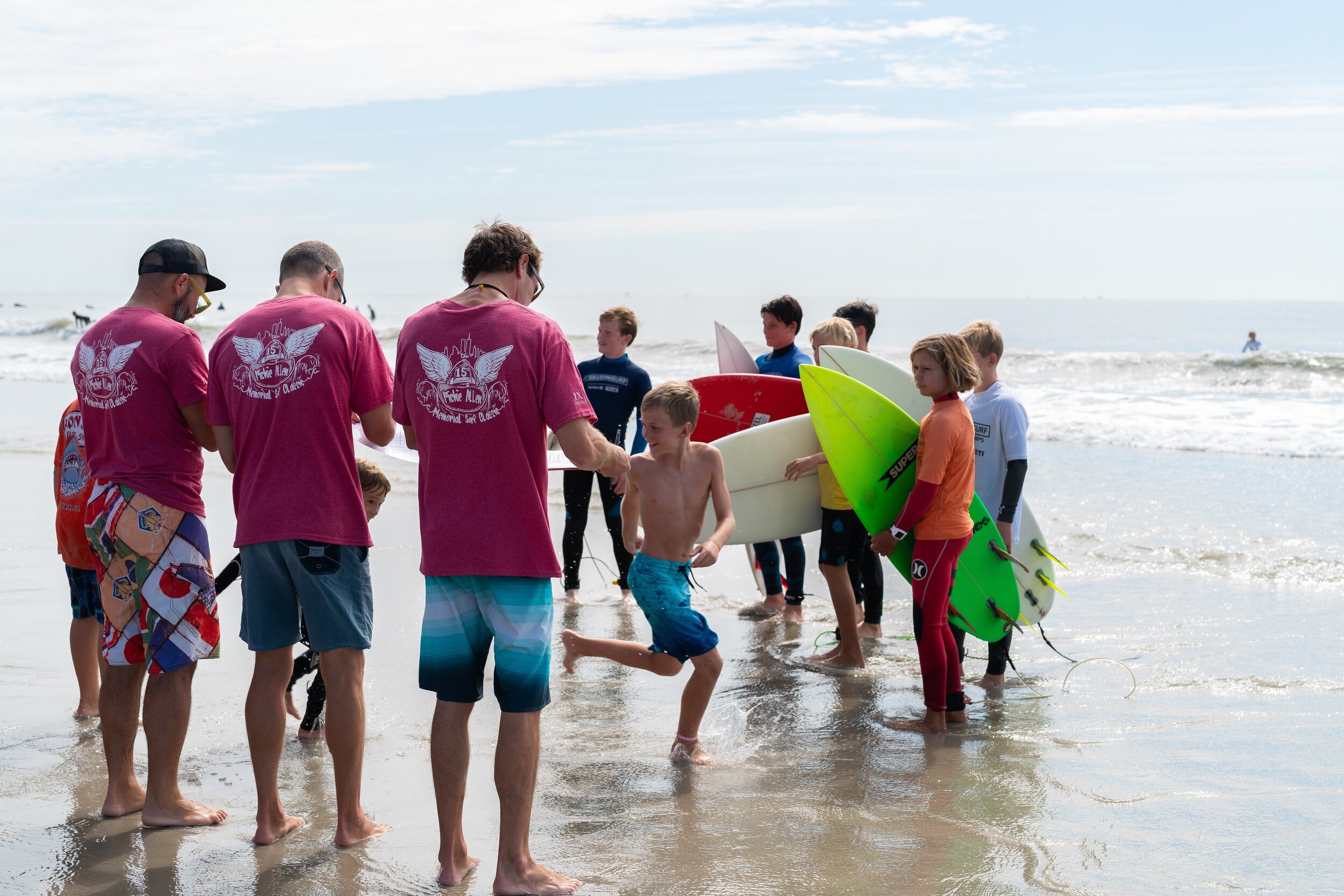   Young surfers wait for directions from the judges before heading into the water to compete in the 15th Annual Richie Allen Memorial Surf Classic.  