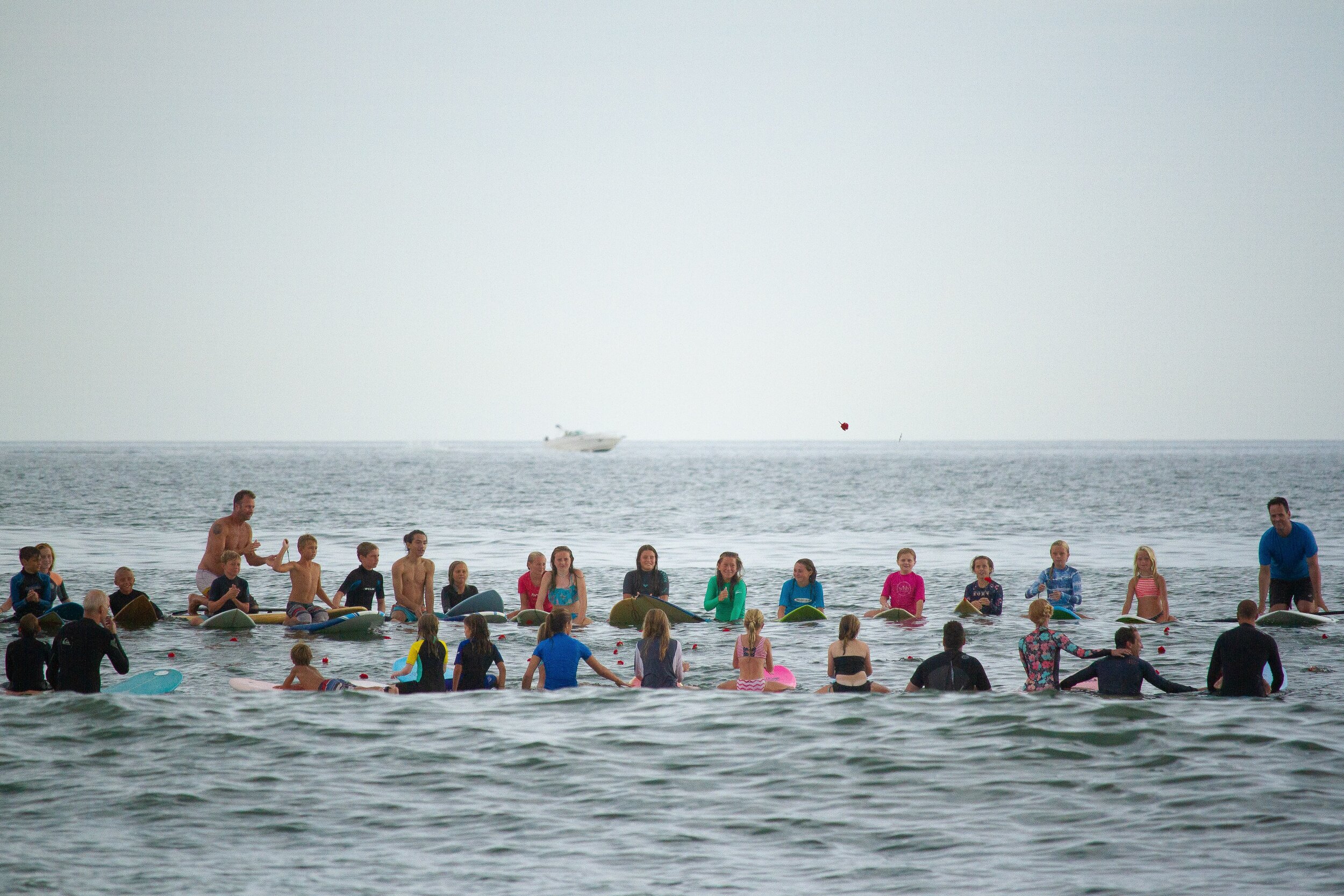   At the end of the day, surfers paddled out together and formed a circle, honoring Richie's memory with kind words and by tossing red carnations into the water.&nbsp;  