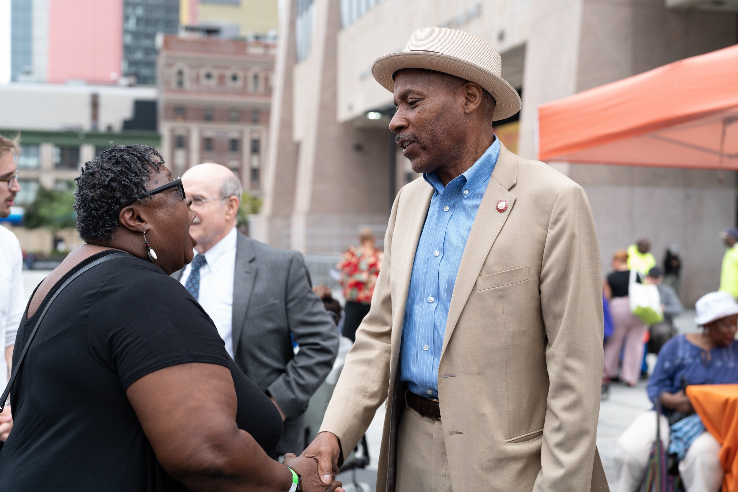   NYC District 9 Councilman Bill Perkins speaks with Harlem senior resident Ethel Croskey, 71.  