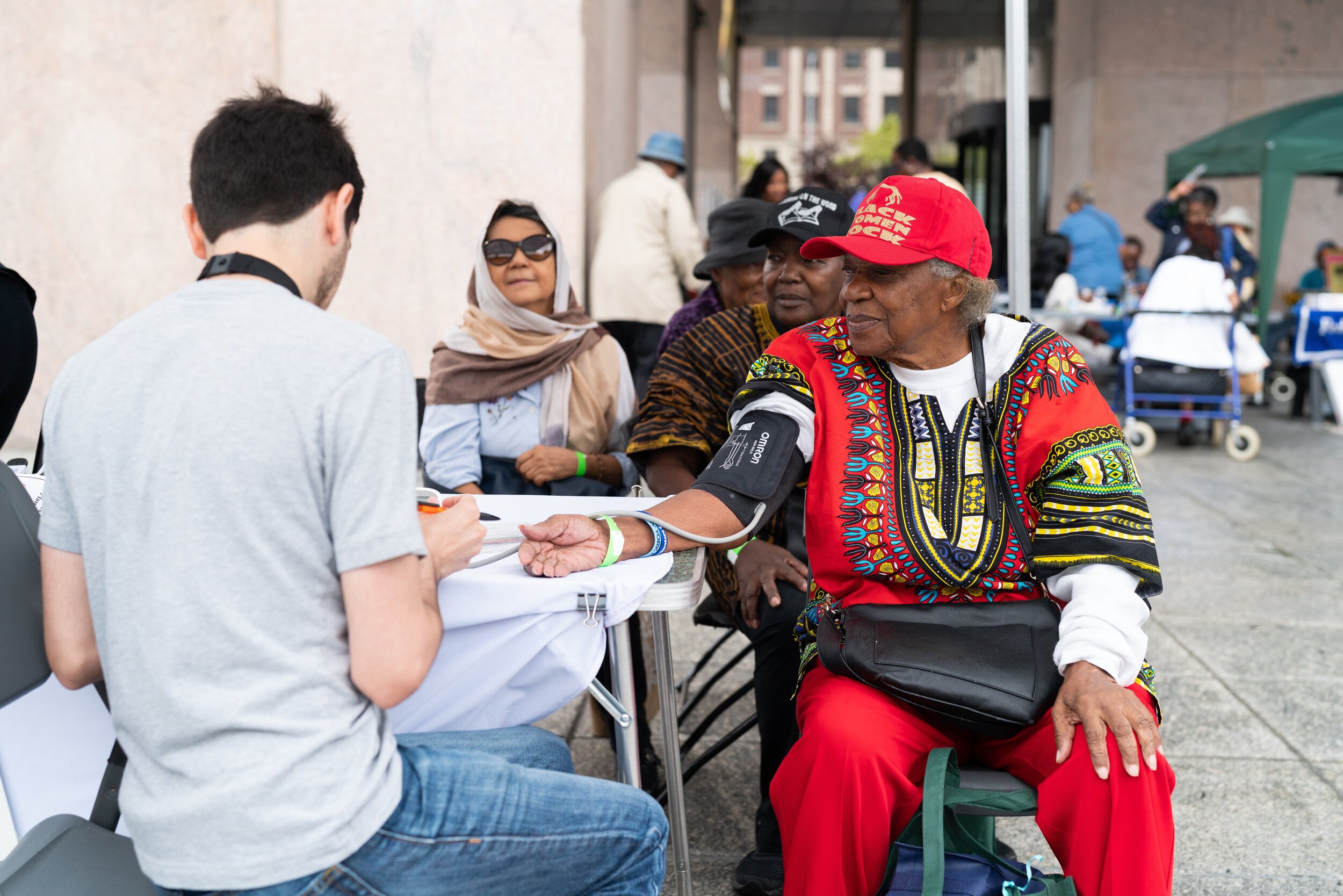   Carol Turneo, 90, gets a free blood pressure screening at Wednesday's Senior Day in Harlem.  