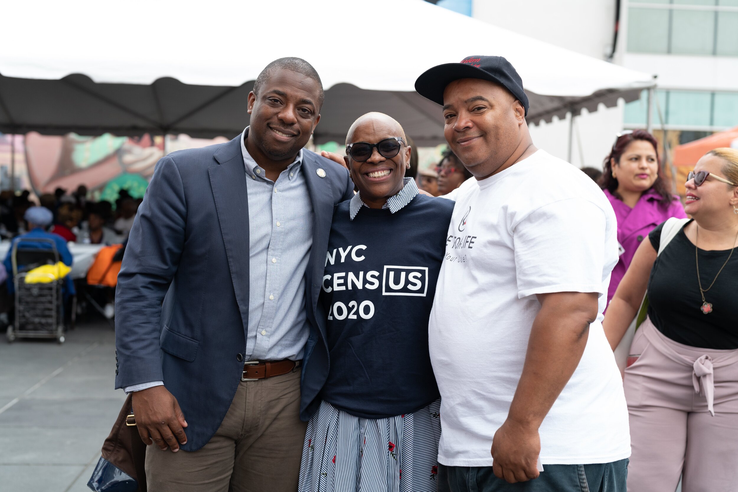   NY State Senator Brian Benjamin poses with Harlem residents Wilma Brown and Eddie Gibbs.  