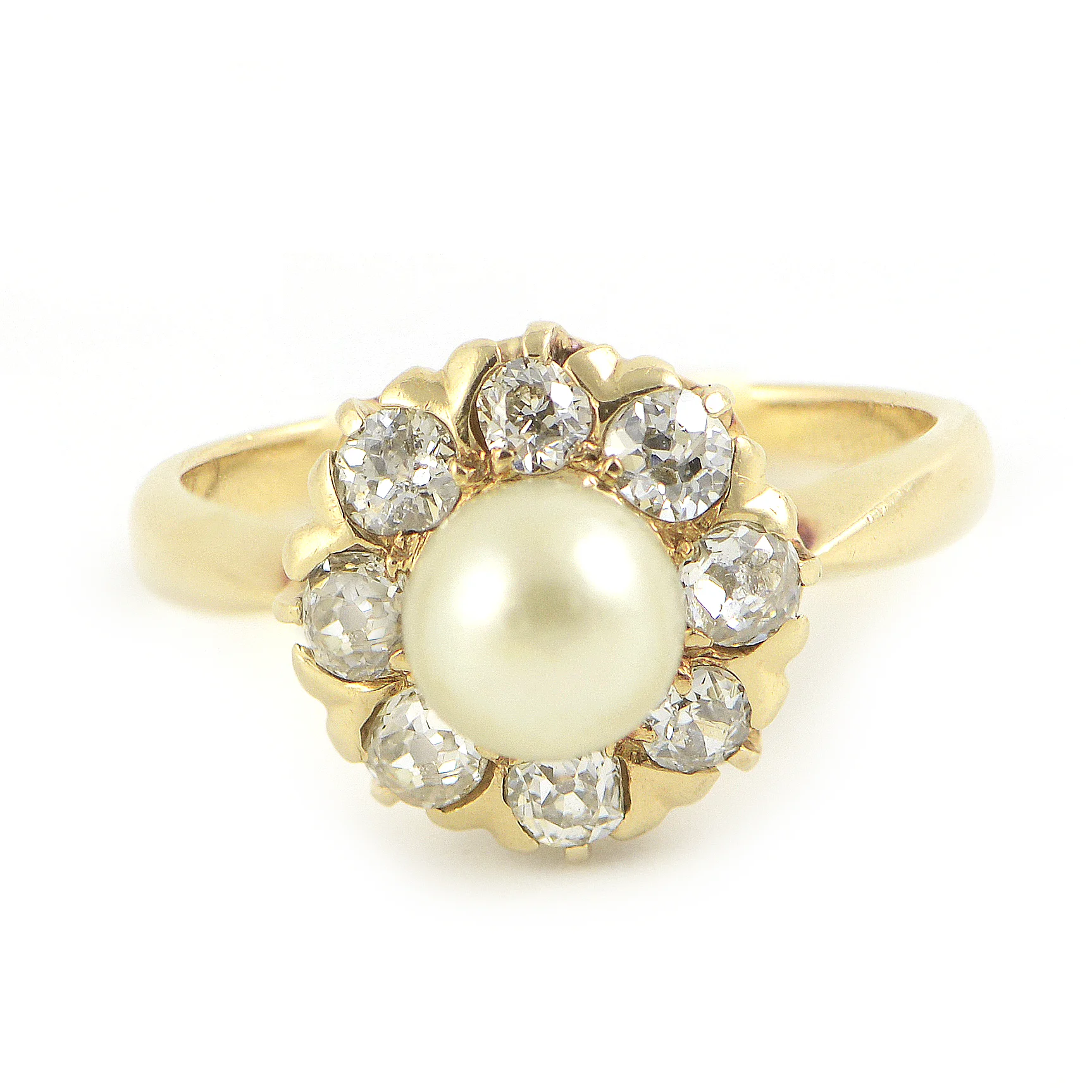 Late Victorian ring featuring a 6.14 mm cultured freshwater pearl. Encircled by a cluster of 8 European cut diamonds. Each diamond is approximately 2.75 mm across.Set in highly polished yellow gold. $2,550.00