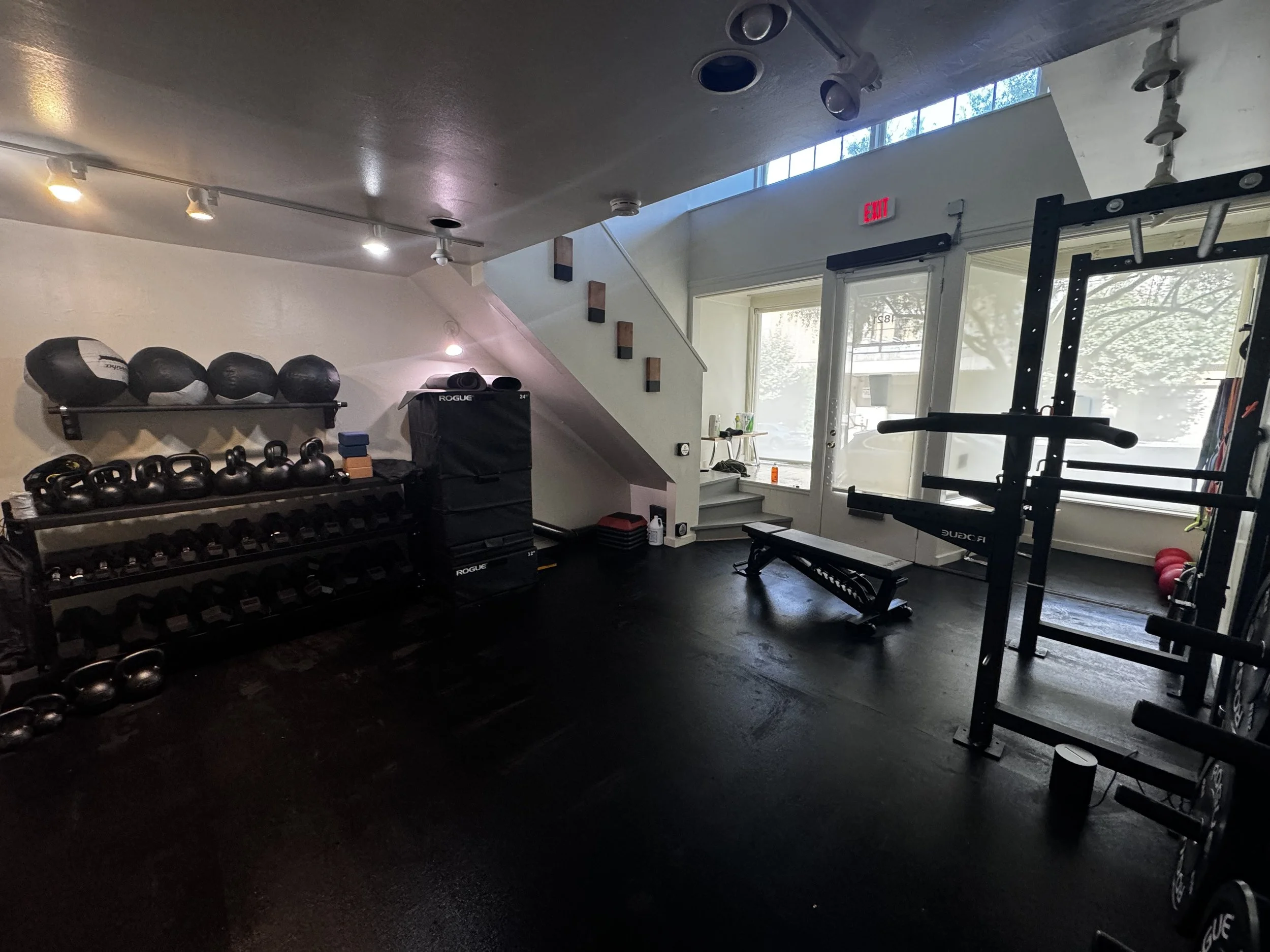 The Kauno gym floor — racks, kettlebells and open training space