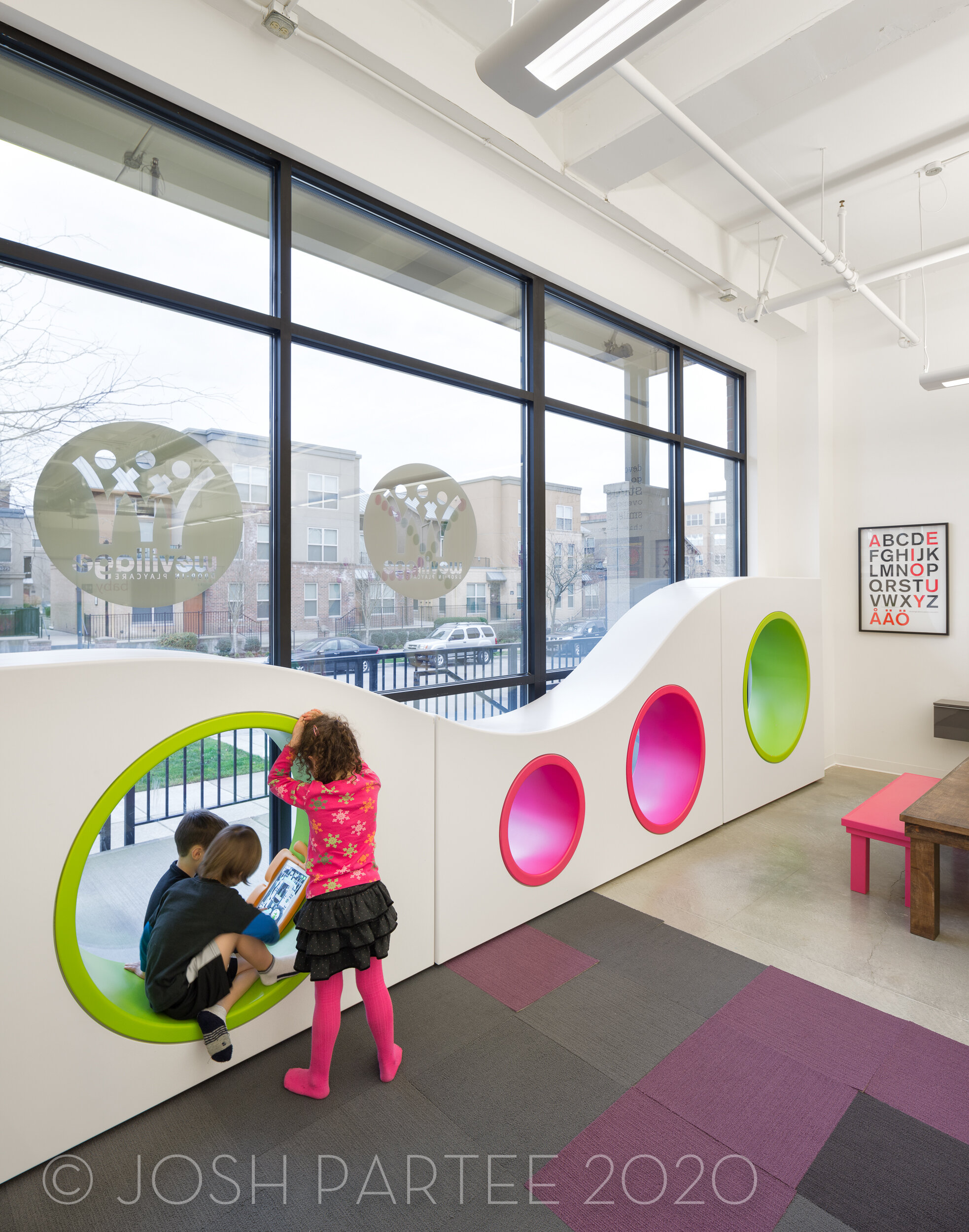 10-WeVillage-JoshPartee-9523-window-wave-kids.jpg