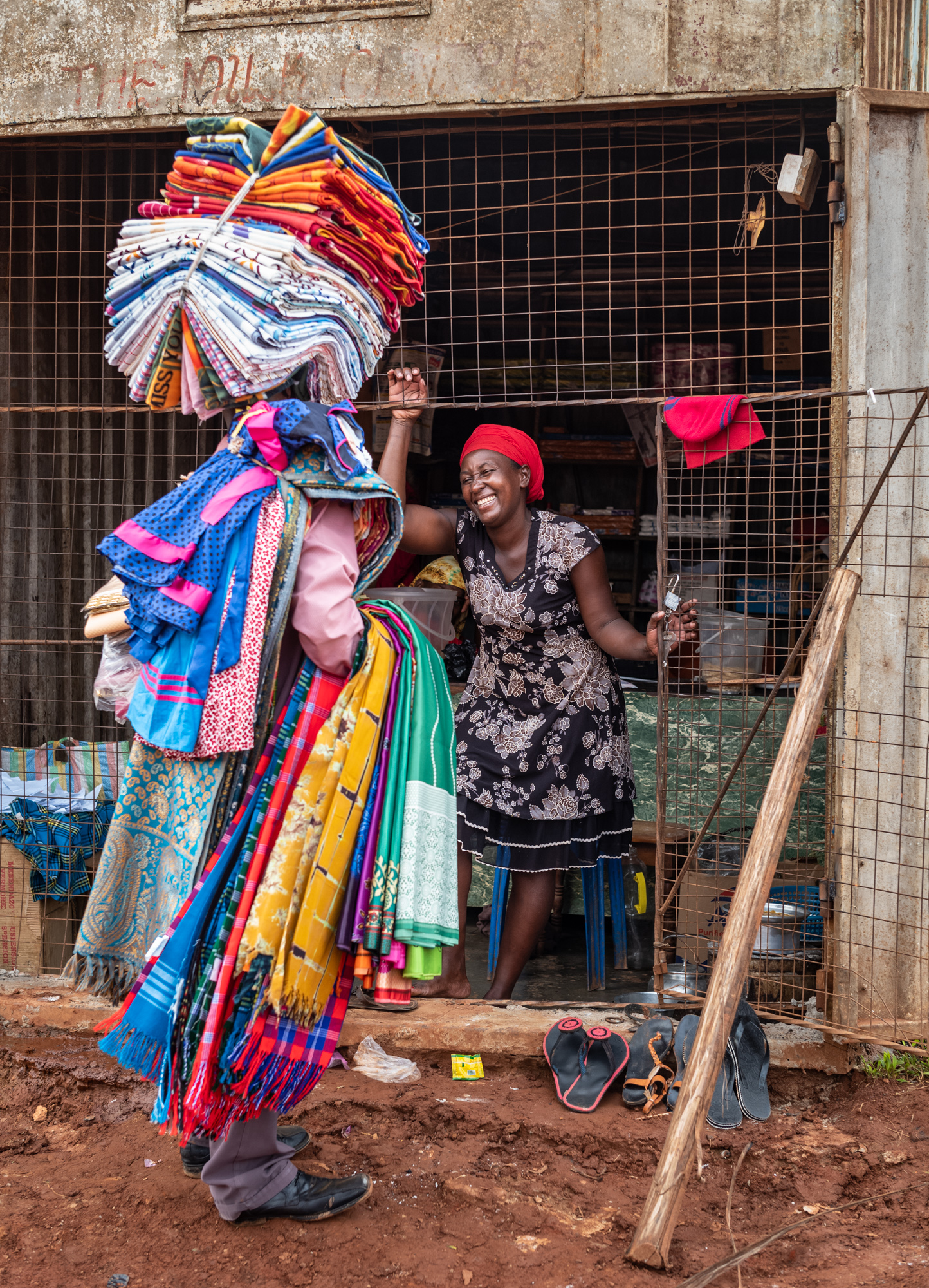 A salesman peddling textiles in  in the village of Kyebando, Uganda