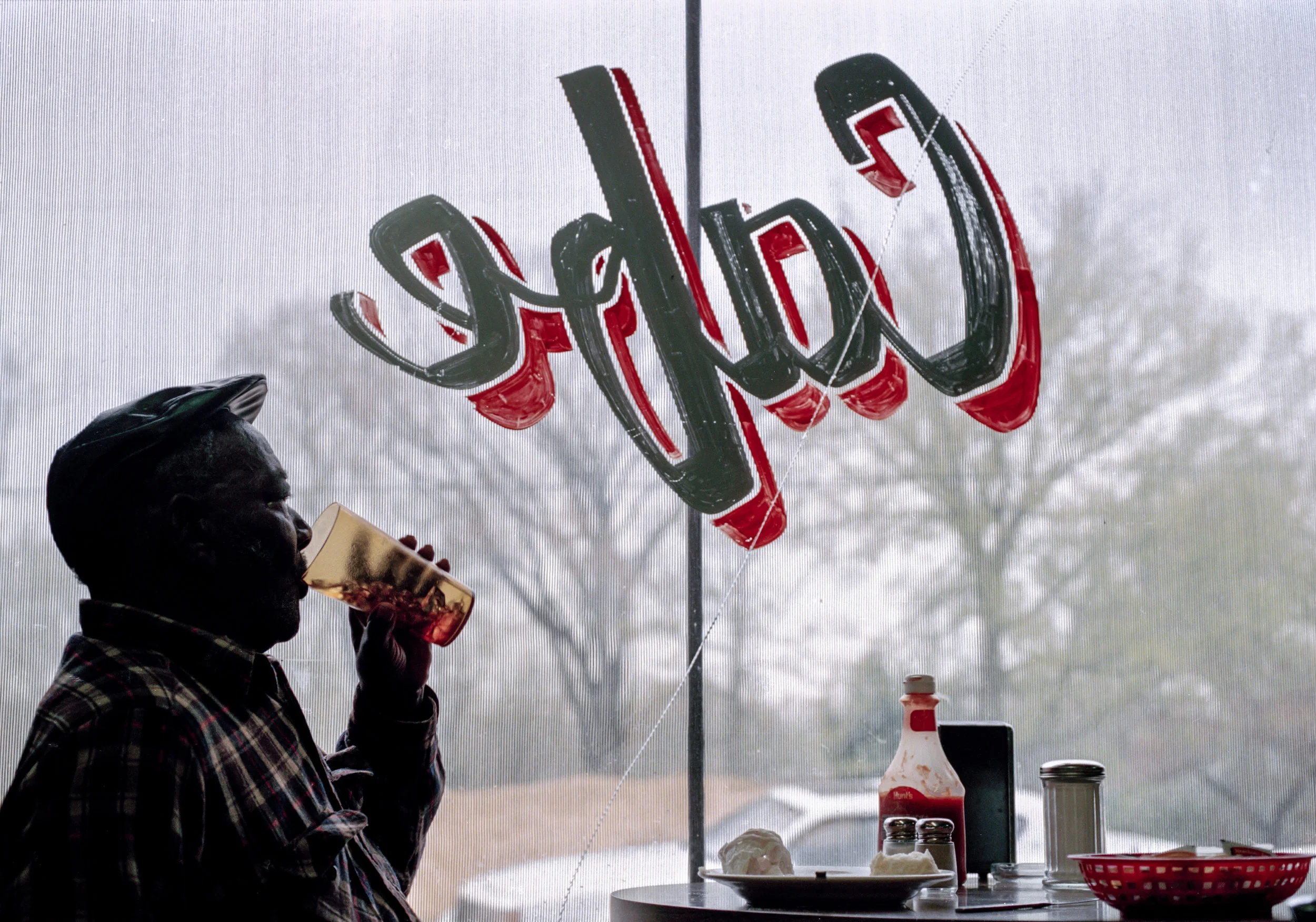 Hester Robert drinks sweet tea at the Boligee Cafe in Boligee, Alabama