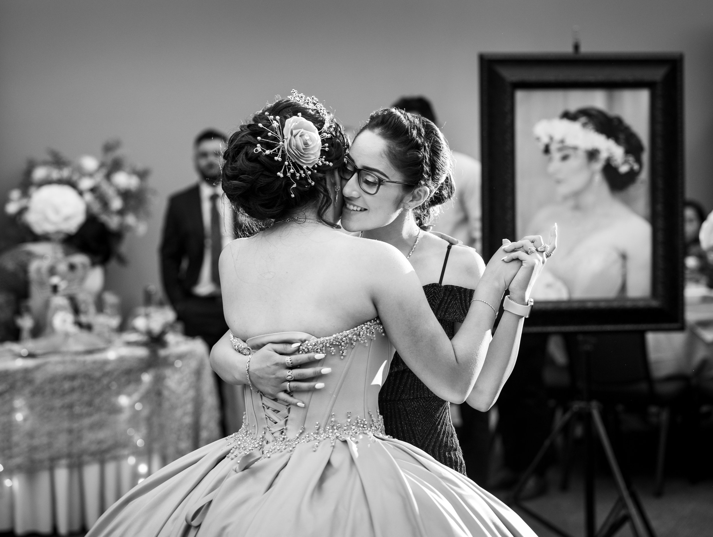 Adriana Gonzalez dances with her sister Paola Gonzalez during Adriana’s quinceañera in Sacramento, California