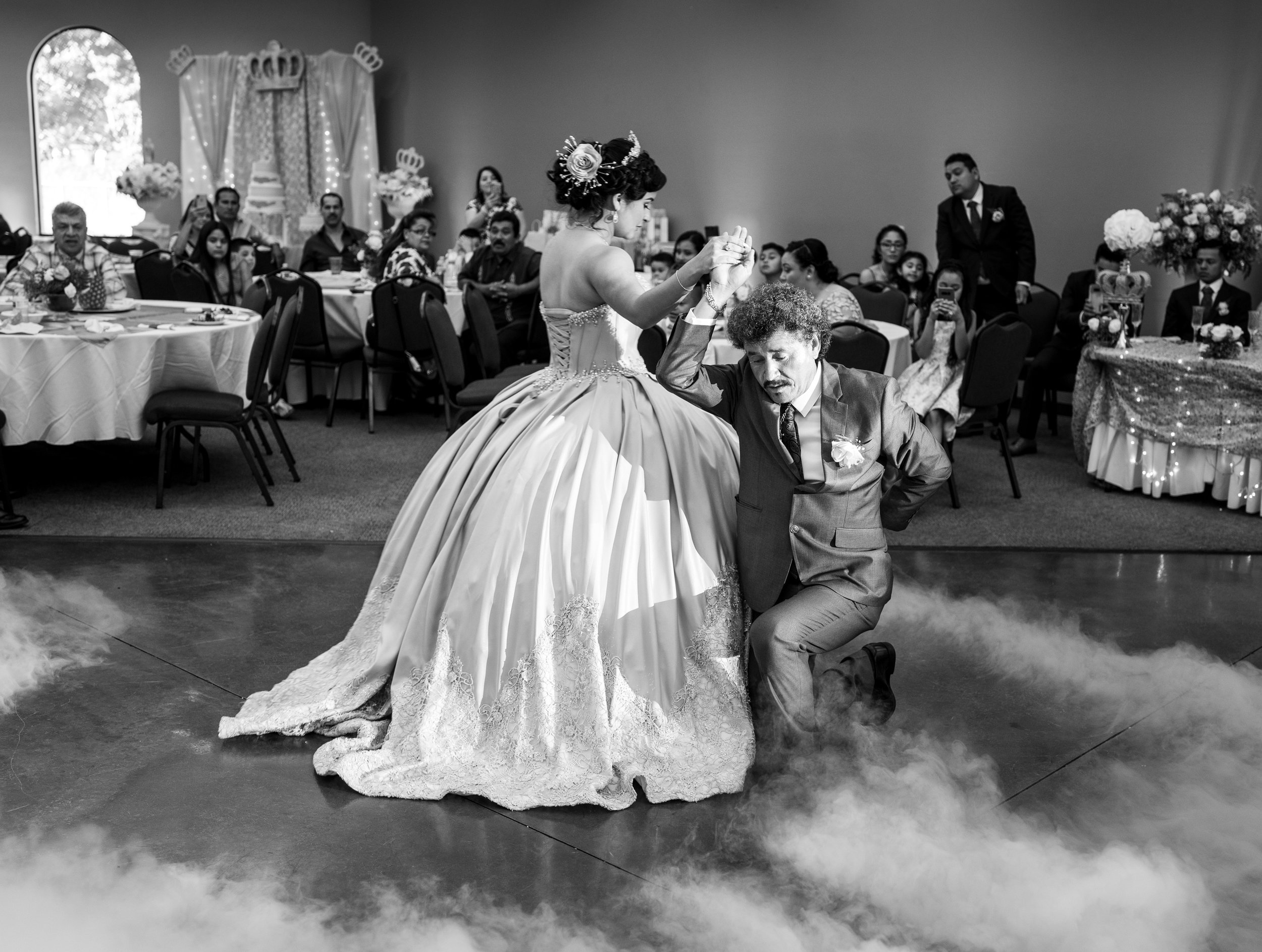 Adolofo Gonzalez and his daughter Adriana Gonzalez waltz during Adriana’s quinceañera in Sacramento, California