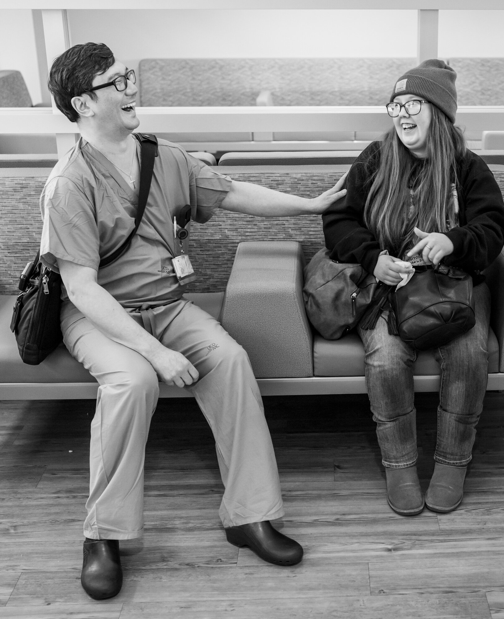 Dr. Michael Wong shares a laugh with Shania Lopez in a waiting room at the UC Davis Medical Center in Sacramento, California