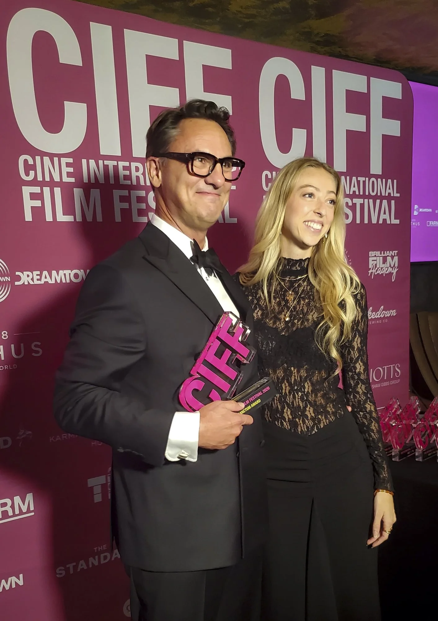 Jim Koenigsaecker accepting an award for Voyage of the Handala from Camille Koefoed at the Cine International Film Festival in London