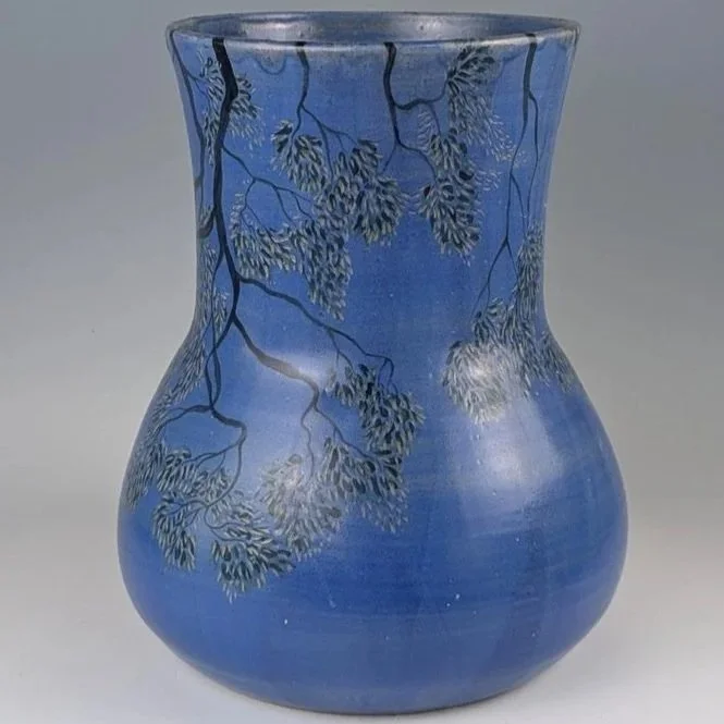 'Carrying the Canopy '(Vessel 2)

A unique collaboration between Nicci Parry Jones and Bronwyn Davies.

Delicate branches are inscribed into the surface, suspended across a soft blue field. The vessel becomes a quiet container of place—balancing obse