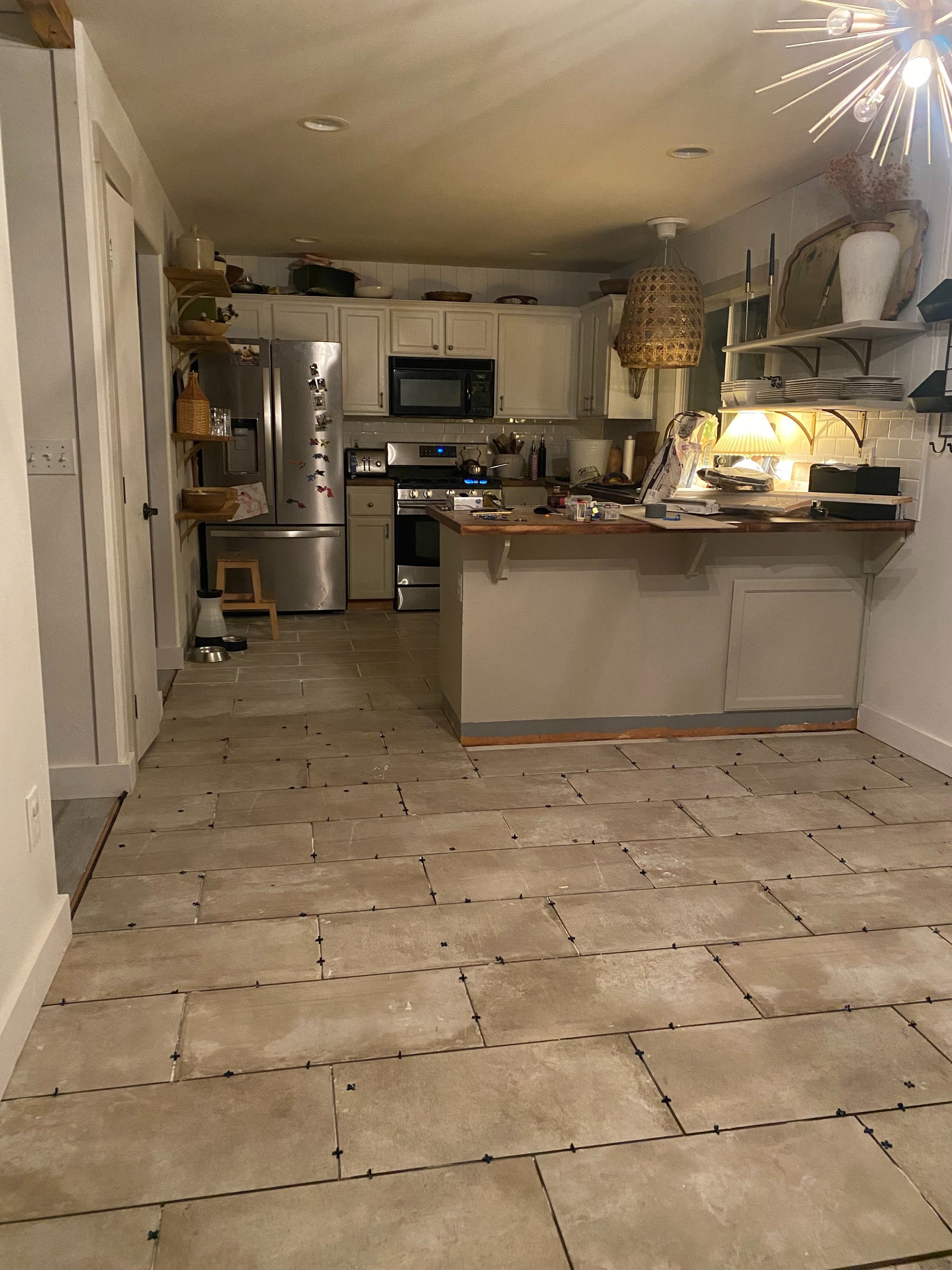  We did the space in 4 parts. The kitchen was first, this was second. The family room we split in two. I wanted to capture this image to compare to the first before photo I took after our old flooring was removed. 