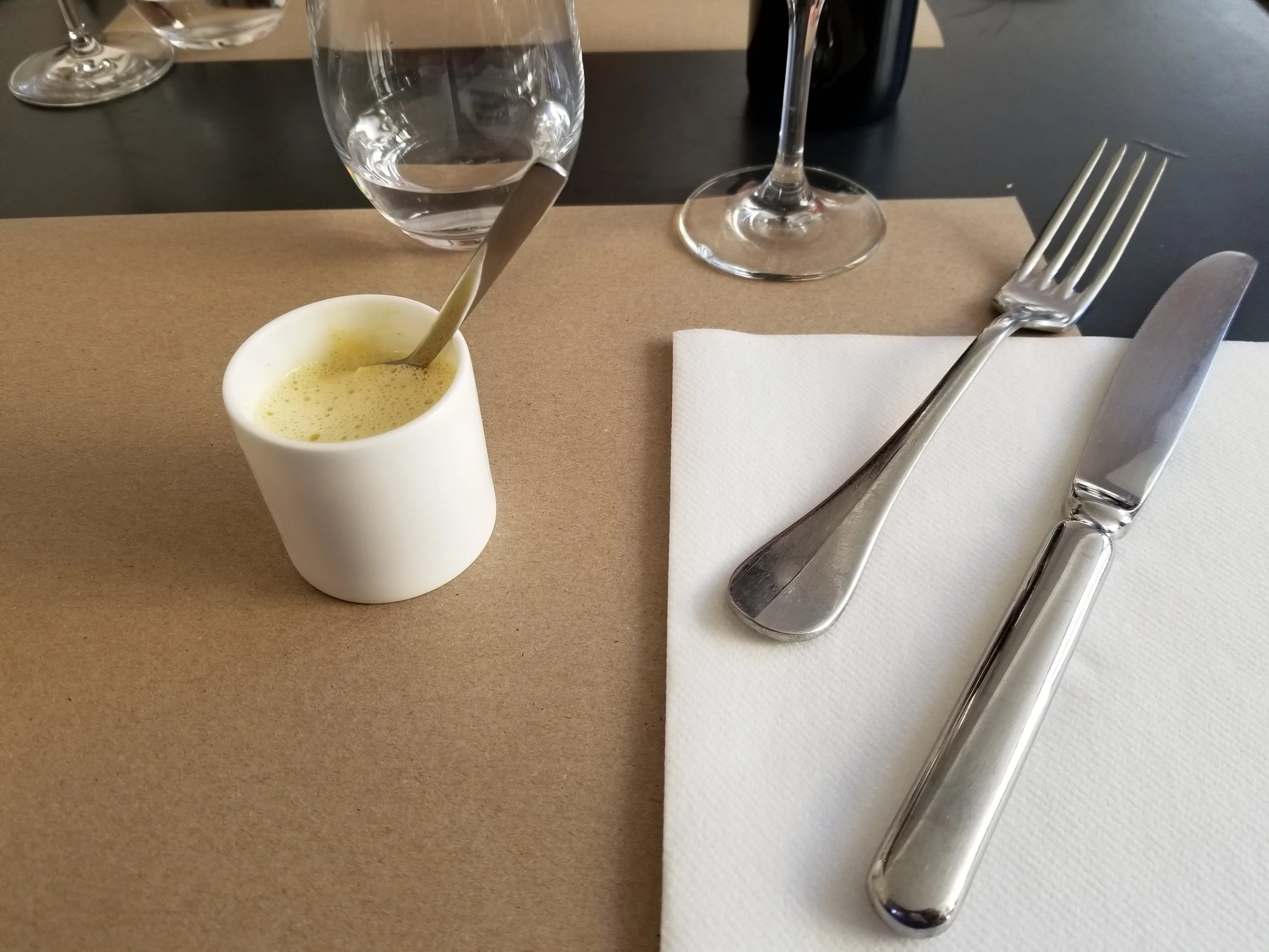 Shortly after we were seated, a server brought us an amuse bouche from the chef, a cup of Royale de Lotte with saffron emulsion