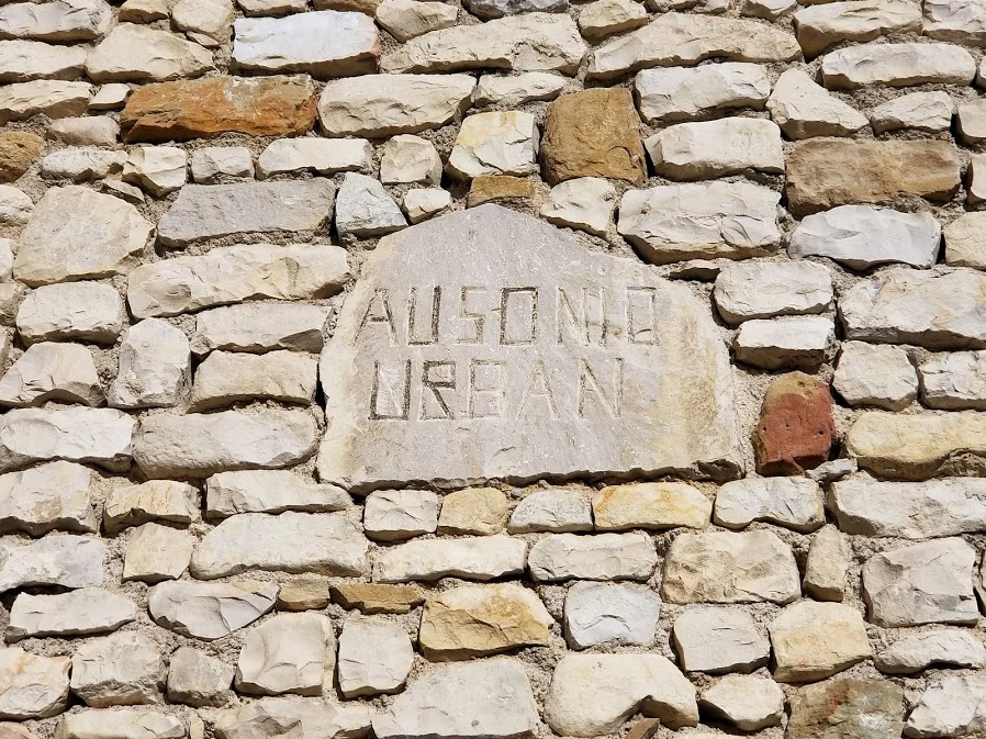 Close-up of stone plate on wall of Sablet House with name of Stone Mason