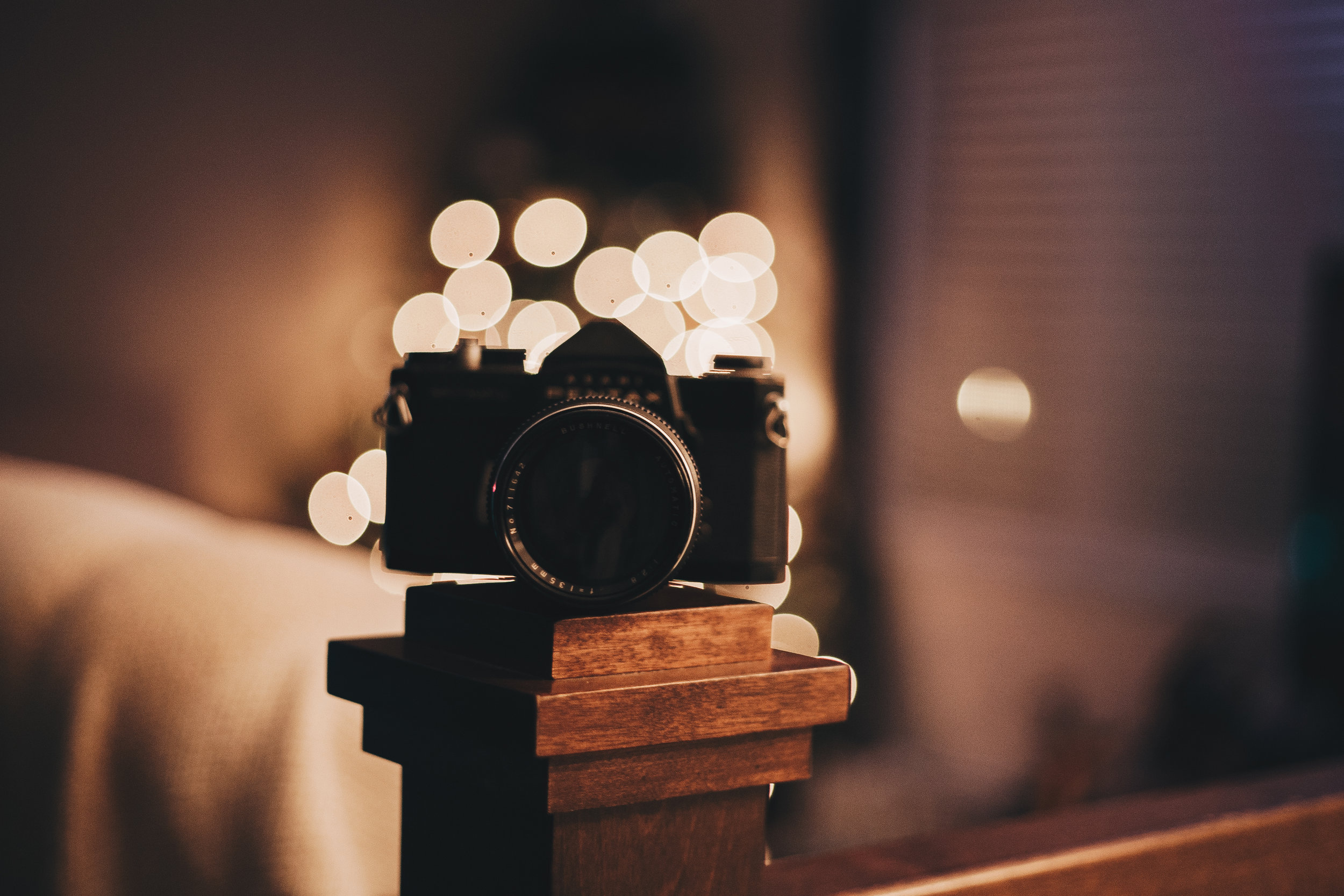 Camera place on top of a wooden bannister