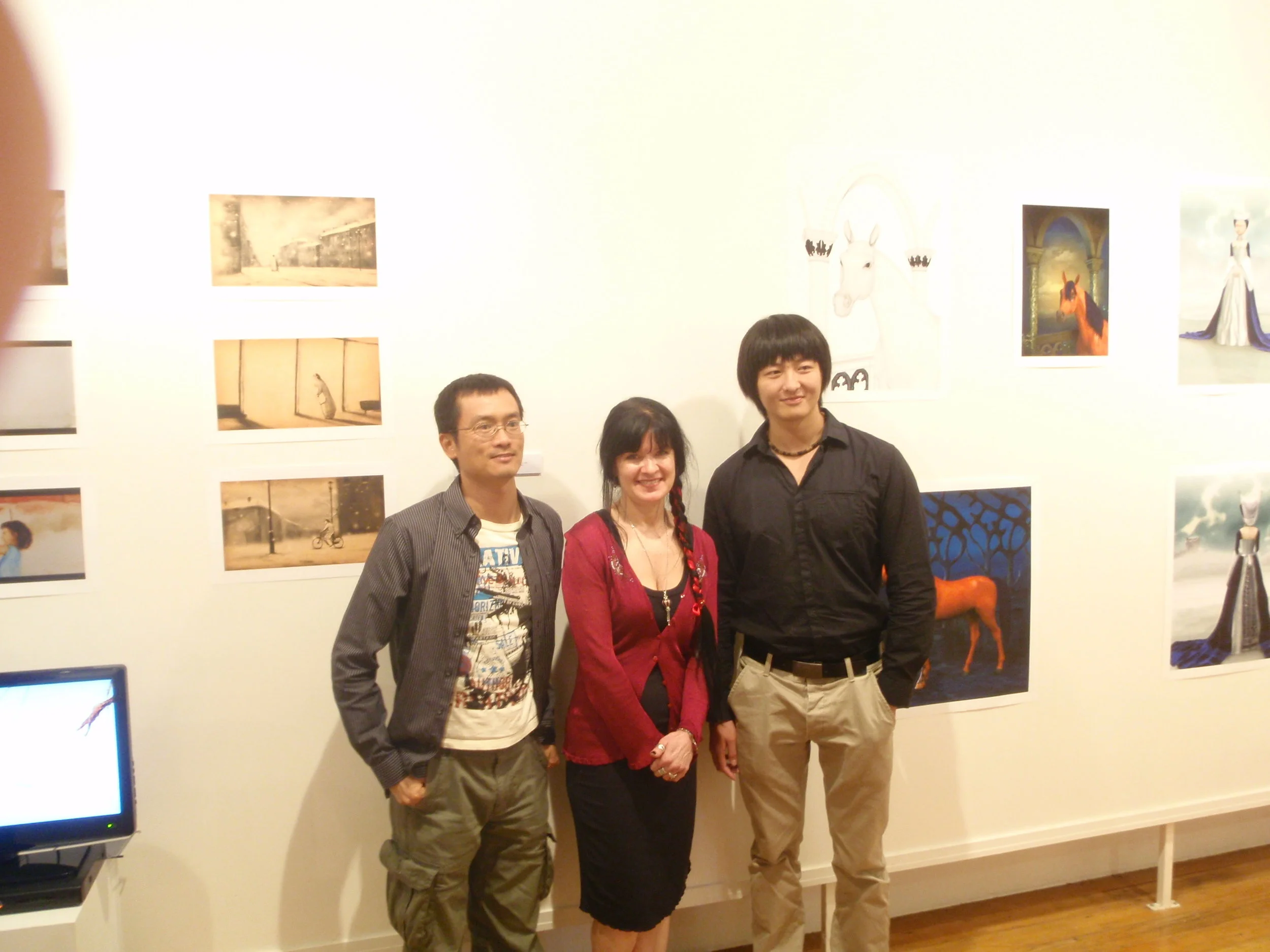 (Jimmy) Zhi-ming Su, Louise Harvey and Xin Li in front of Xin and Louise's work 