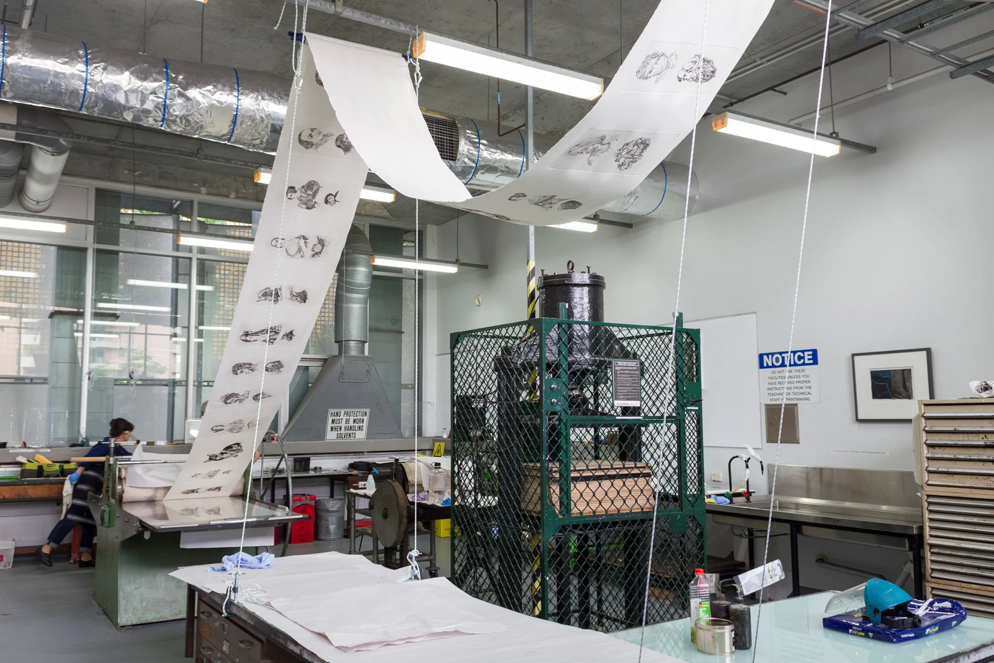 The final roll coming off the press. This completes over 40 metres of running wall sheets of etchings. (photography Blair Coffey)