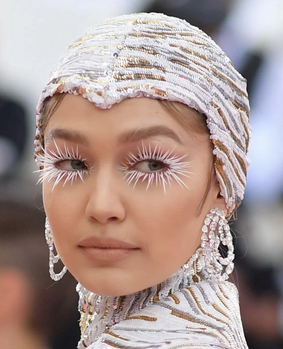 GIGI HADID- GOES FULL ON LIBERACE IN STEPHEN JONES MILLINERY