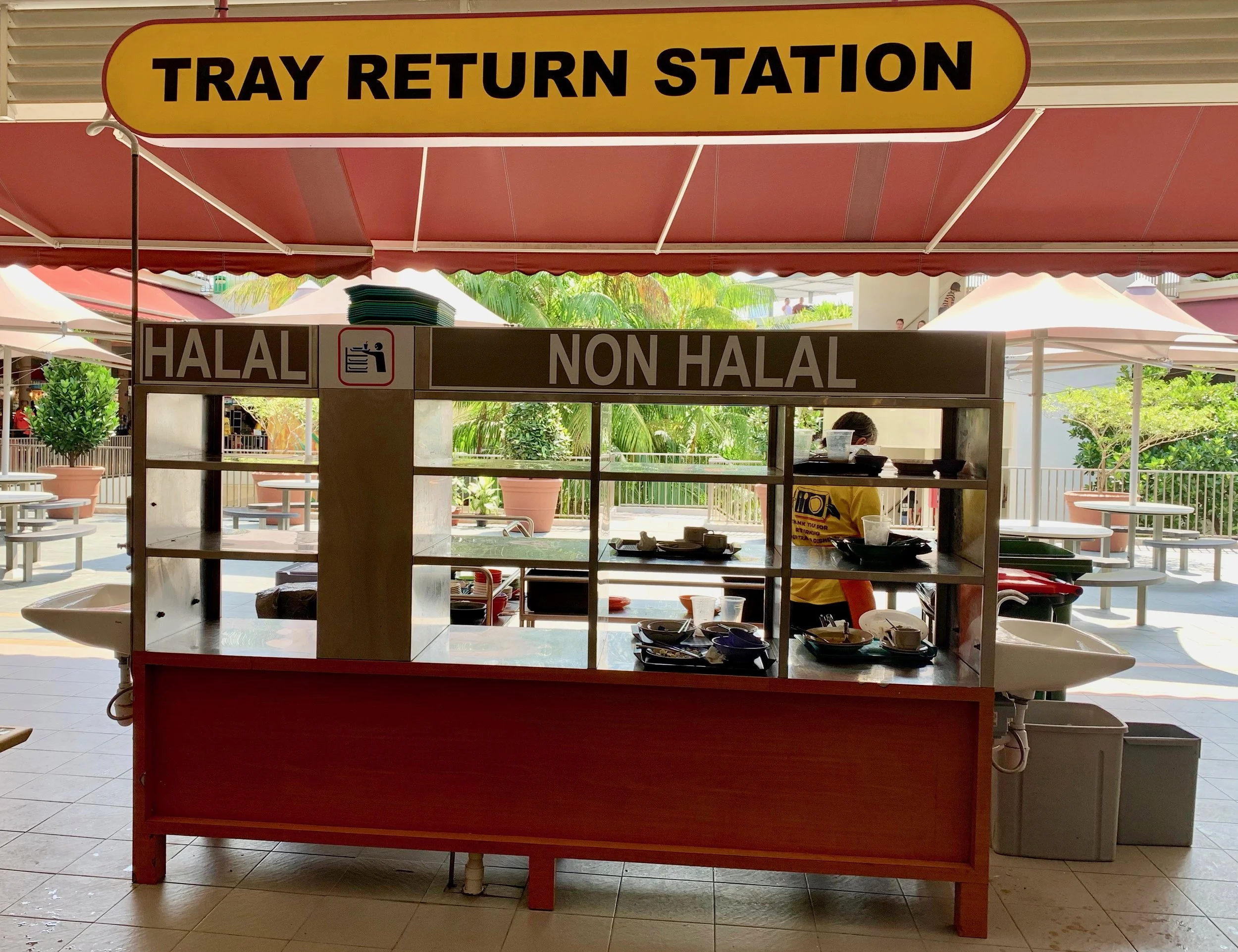 Singaporeans are very considerate of all ethnic groups. Some of the hawker stalls serve halal food, which means it is prepared in a way that adheres to Islamic law. Halal food trays/containers/utensils should not mix with non-halal food items.