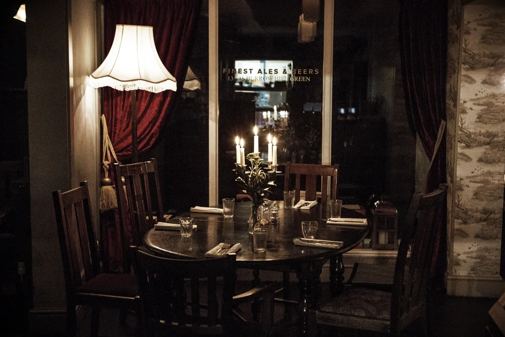 A candlelit table in the dining room