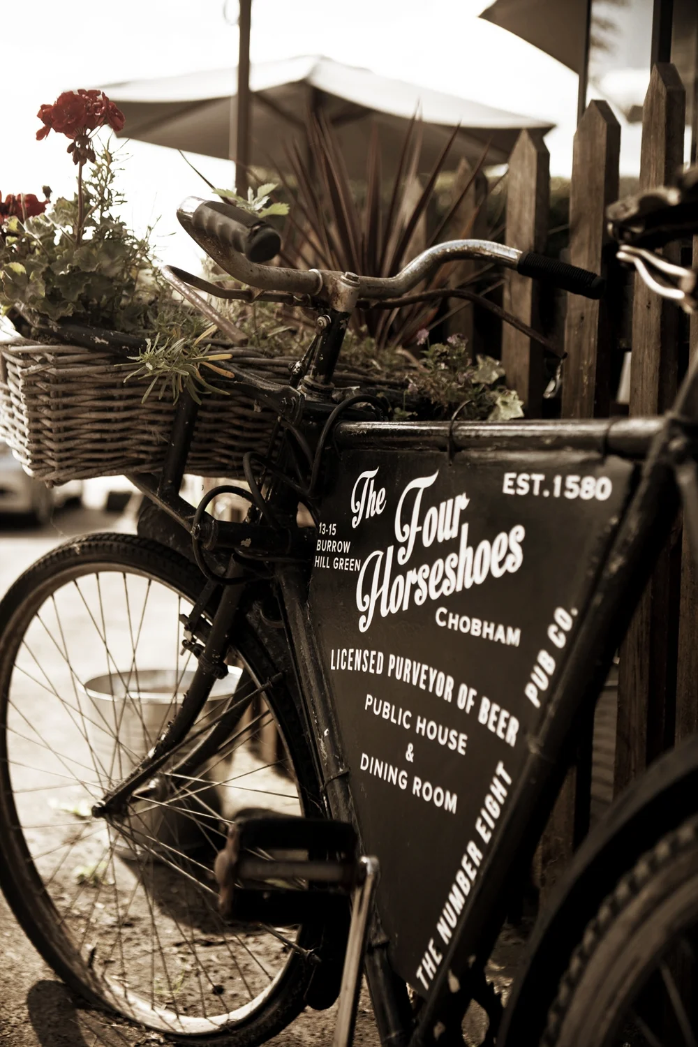 The pub's vintage delivery bicycle, signwritten The Four Horseshoes