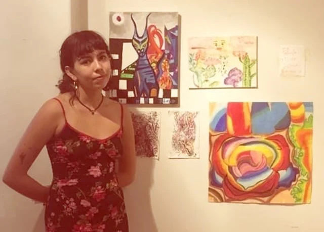 Paloma Diaz next to her work, at Color Theory Club II