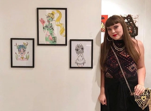 Claire Dennis next to her work, at Color Theory Club II
