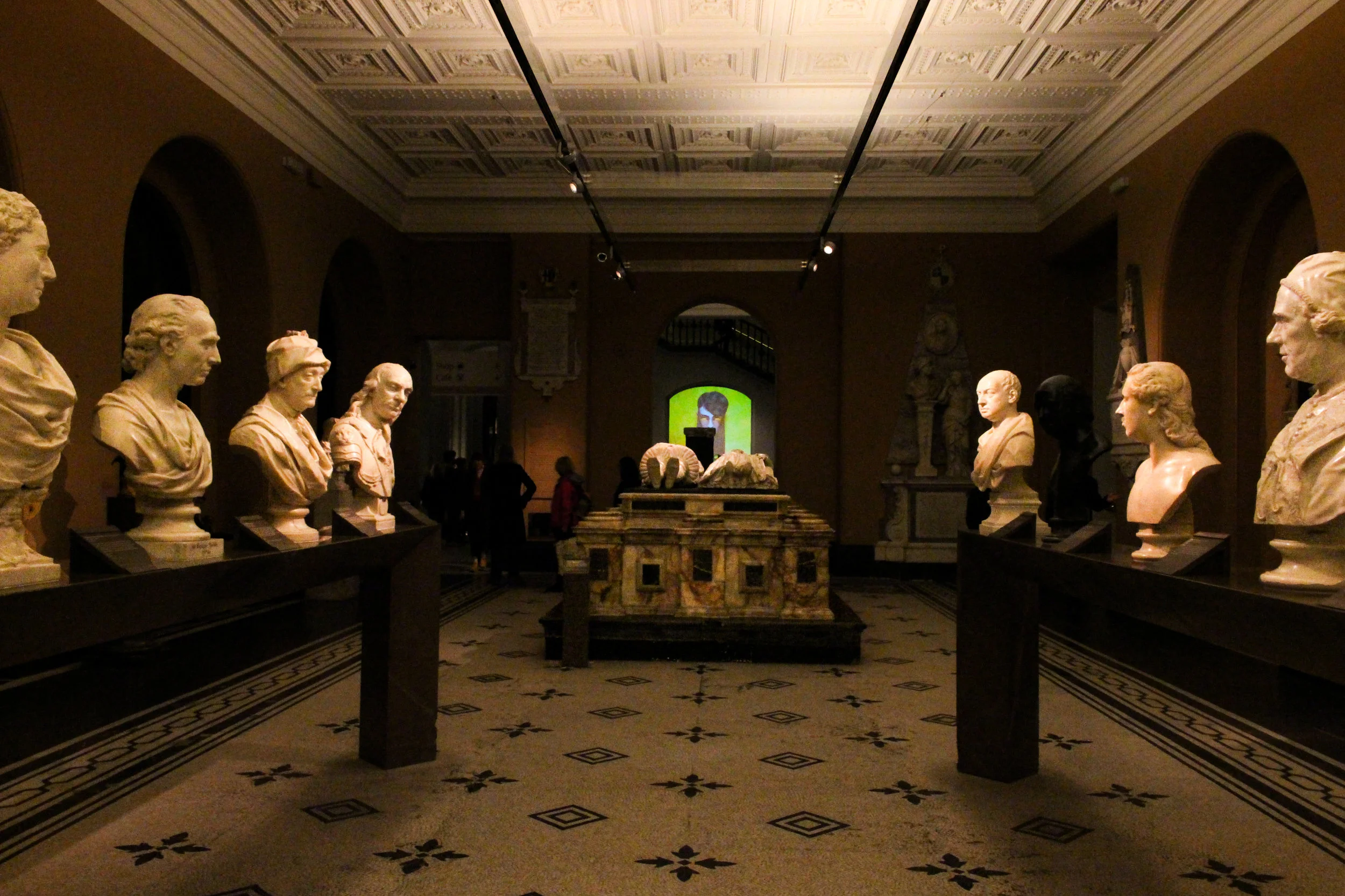 whiskey being stared by statues.jpg