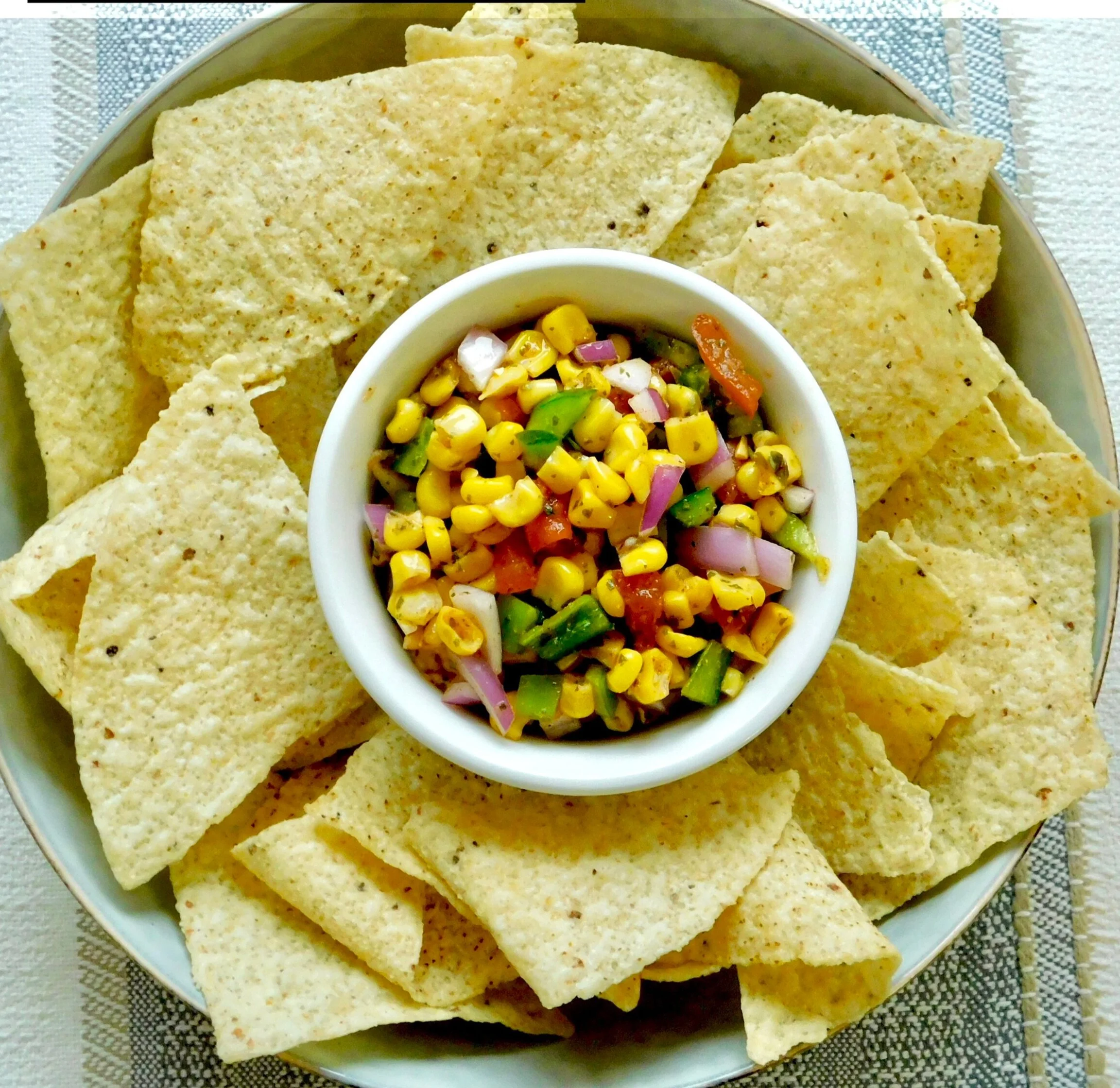 Corn salsa served with tortilla chips
