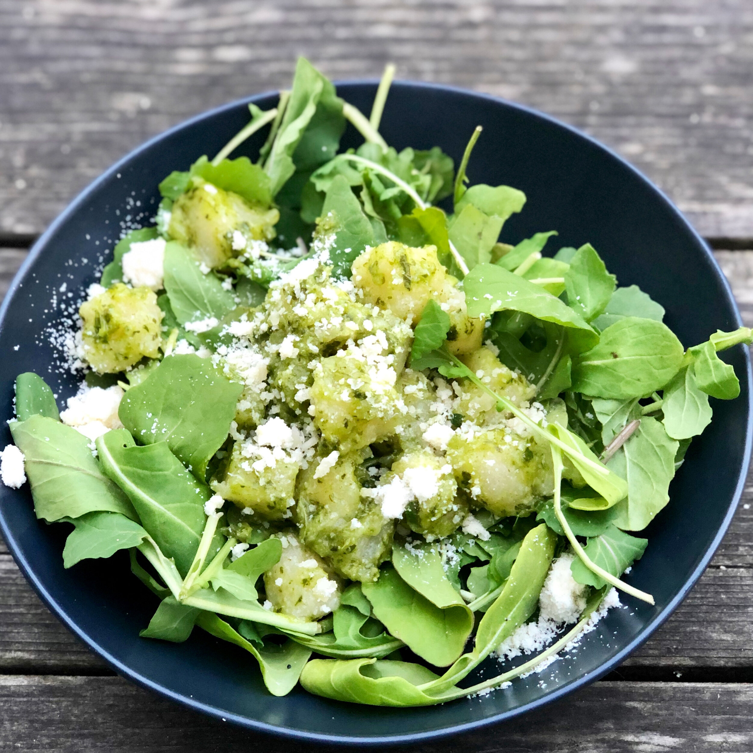 Healthifying a frozen cauliflower meal with some homemade parsley pesto and arugula!