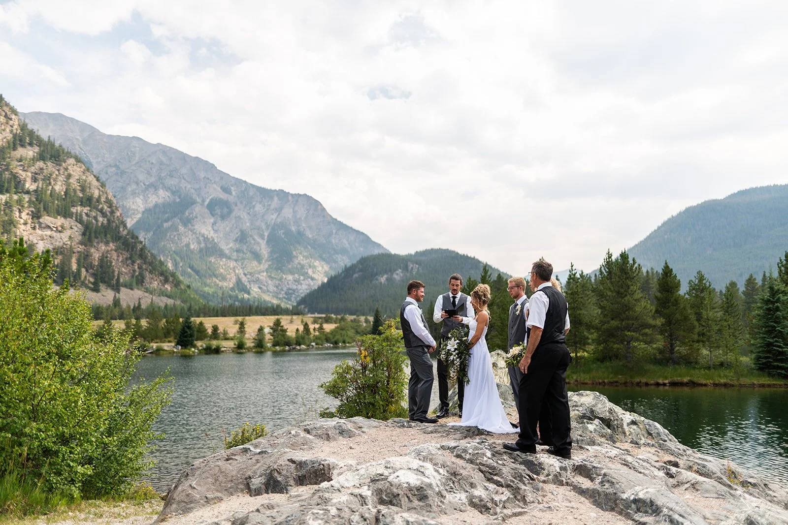 small group having a wedding at a lake in breckenridge colorado